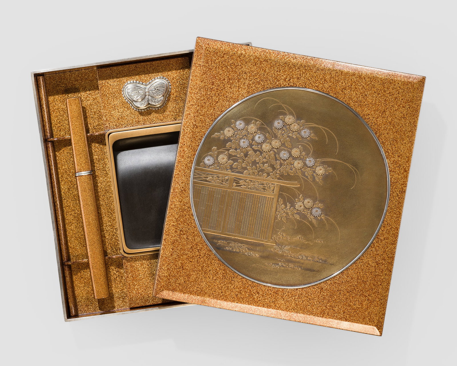 A SMALL GOLD AND SILVER INLAID LACQUER 'CHRYSANTHEMUMS' SUZURIBAKO (WRITING BOX): A SMALL GOLD AND SILVER INLAID LACQUER 'CHRYSANTHEMUMS' SUZURIBAKO (WRITING BOX) Japan, Meiji period (1868-1912) Of rectangular form, the inrobuta (flush-fitting) lid features a nashiji ground and is 