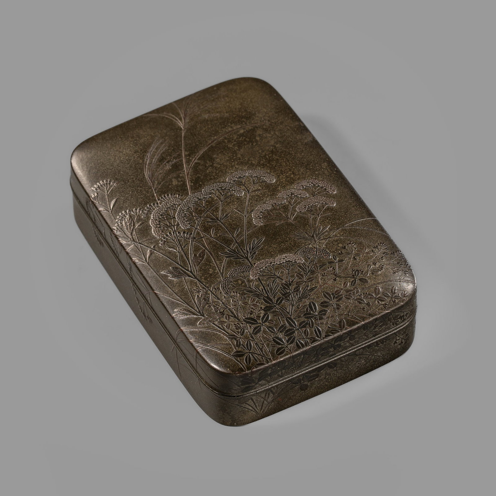 A MAGNIFICENT SHIBUICHI-NURI LACQUER 'AUTUMN GRASSES' KOBAKO (SMALL BOX): A MAGNIFICENT SHIBUICHI-NURI LACQUER 'AUTUMN GRASSES' KOBAKO (SMALL BOX) Japan, 19th century, late Edo (1615-1868) to Meiji period (1868-1912) Of upright rectangular form with rounded sides, bearing a