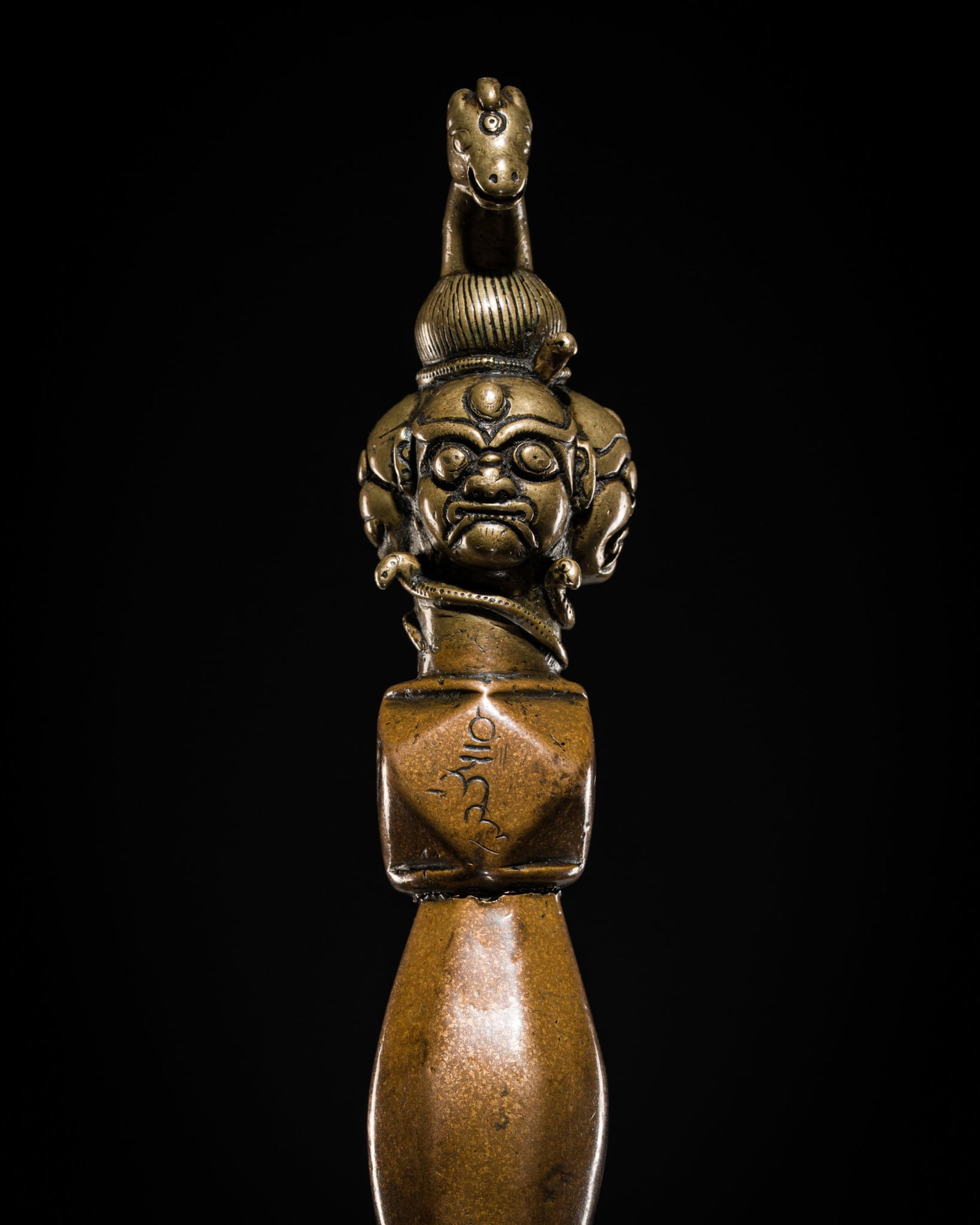 A RARE AND MASSIVE BRASS, COPPER AND IRON 'HAYAGRIVA' PHURBA, TIBET, CIRCA 12TH-13TH CENTURY (1 of 15)
