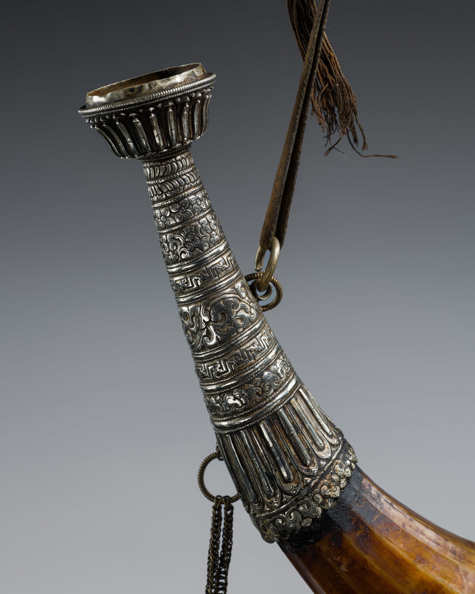 A METAL REPOUSSÉ MOUNTED HORN FLASK, 19TH-EARLY 20TH CENTURY (1 of 17)