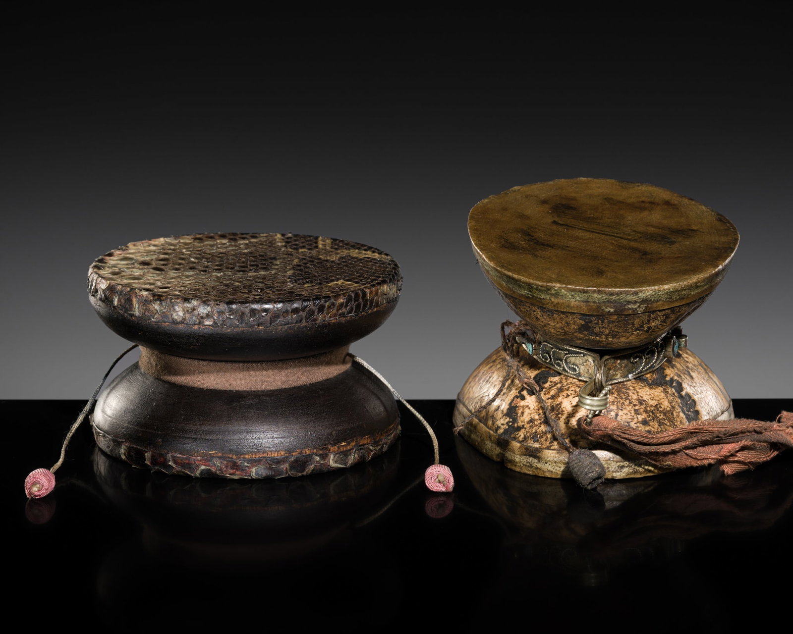 A PAIR OF TURQUOISE AND CORAL INLAID METAL AND BONE RITUAL DRUMS, DAMARU, 18TH-19TH CENTURY (1 of 12)