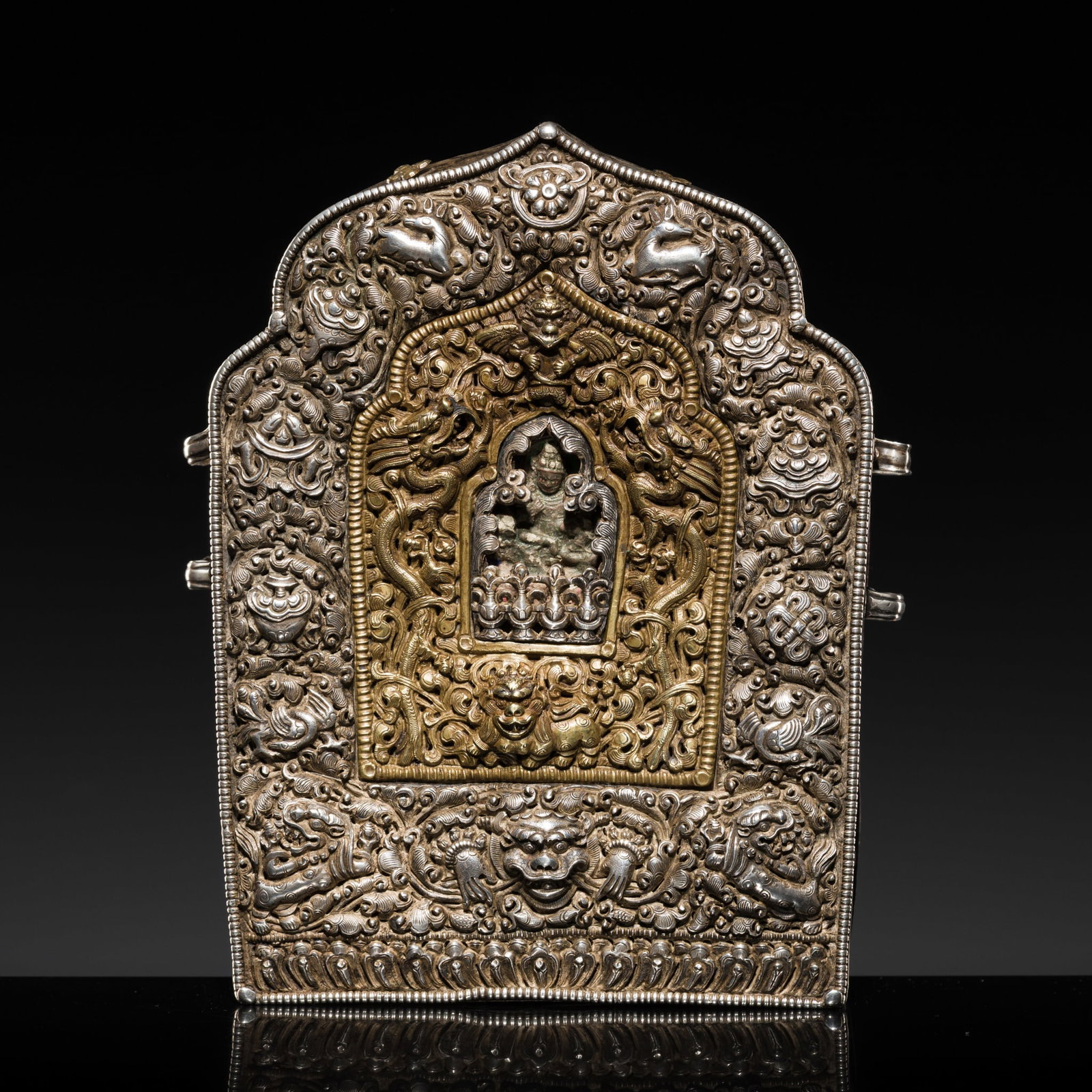 A FINE RETICULATED AND EMBOSSED PARCEL-GILT SILVER AND COPPER PORTABLE SHRINE WITH TSA-TSA, GAU (1 of 20)