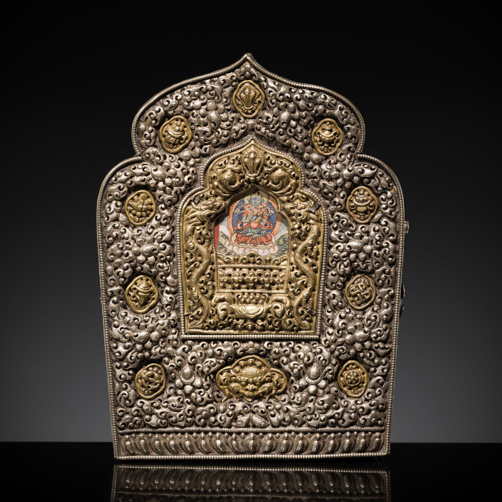 A PARCEL-GILT MIXED-METAL GAU WITH A PAINTING OF VAJRADHARA AND CONSORT, 18TH-19TH CENTURY (1 of 17)