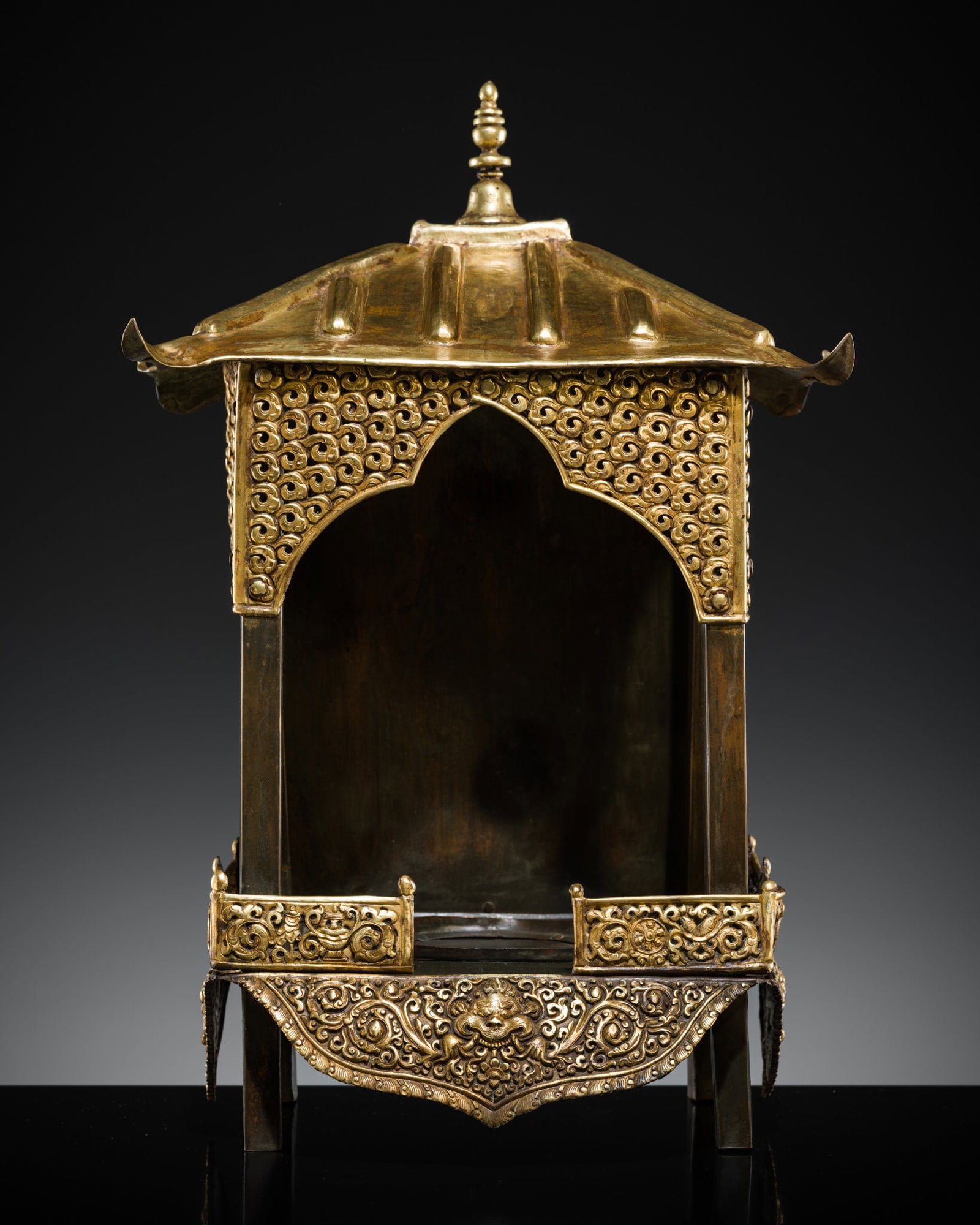A PARCEL-GILT COPPER ALLOY REPOUSSÉ BUDDHIST SHRINE, TIBET, 19TH CENTURY AND EARLIER (1 of 14)