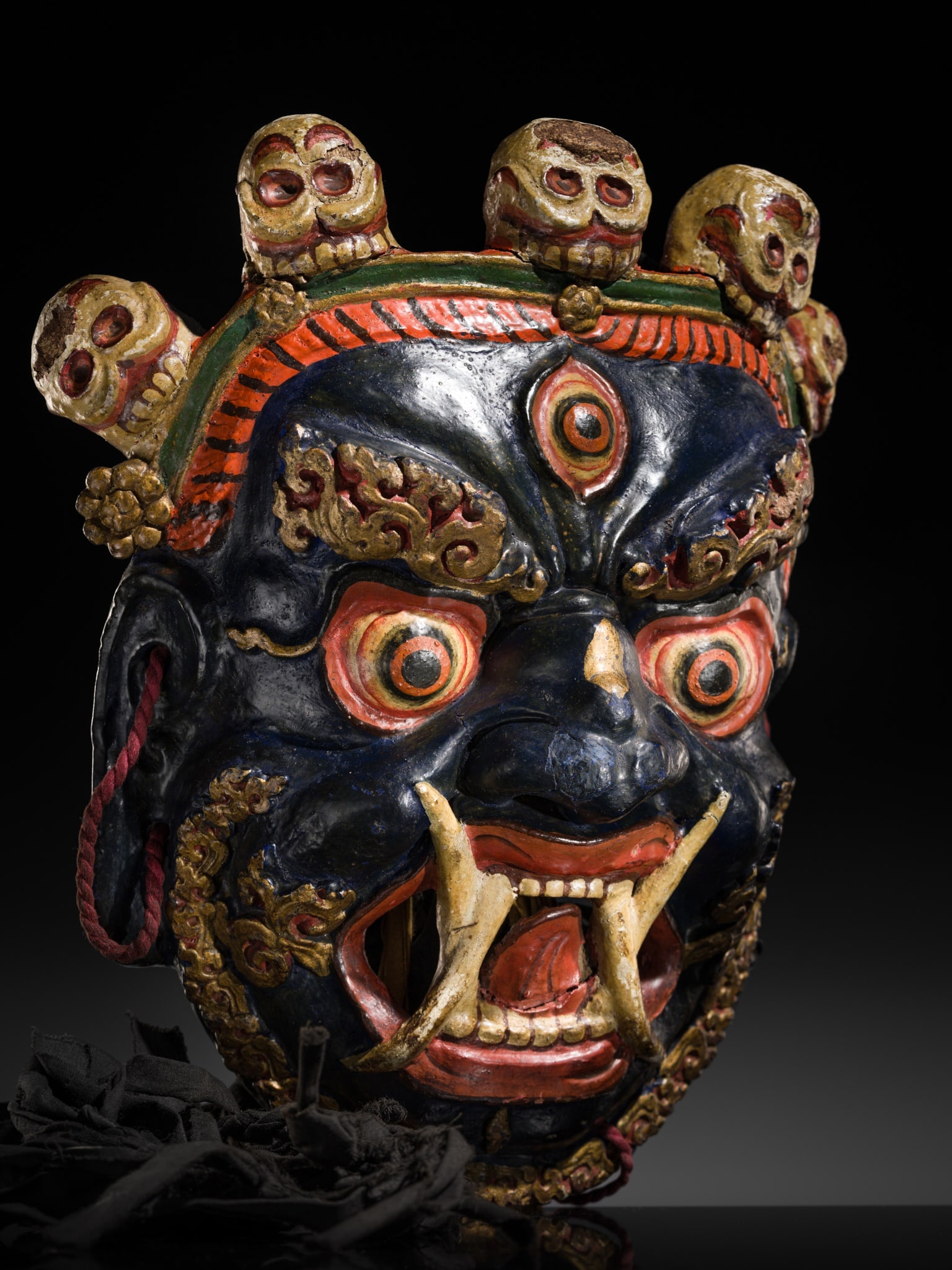 A POLYCHROME AND GILT-LACQUERED PAPIER-MÂCHÉ 'MAHAKALA' RITUAL MASK FOR THE CHAM DANCE (1 of 16)