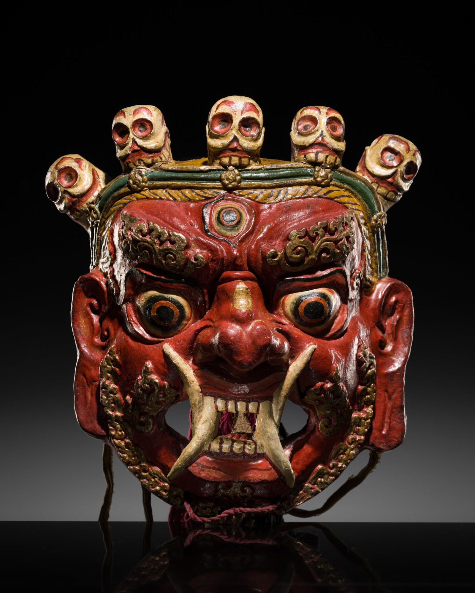 A POLYCHROME AND GILT-LACQUERED PAPIER-MÂCHÉ 'SHINJE CHOGYEL' RITUAL MASK FOR THE CHAM DANCE (1 of 18)