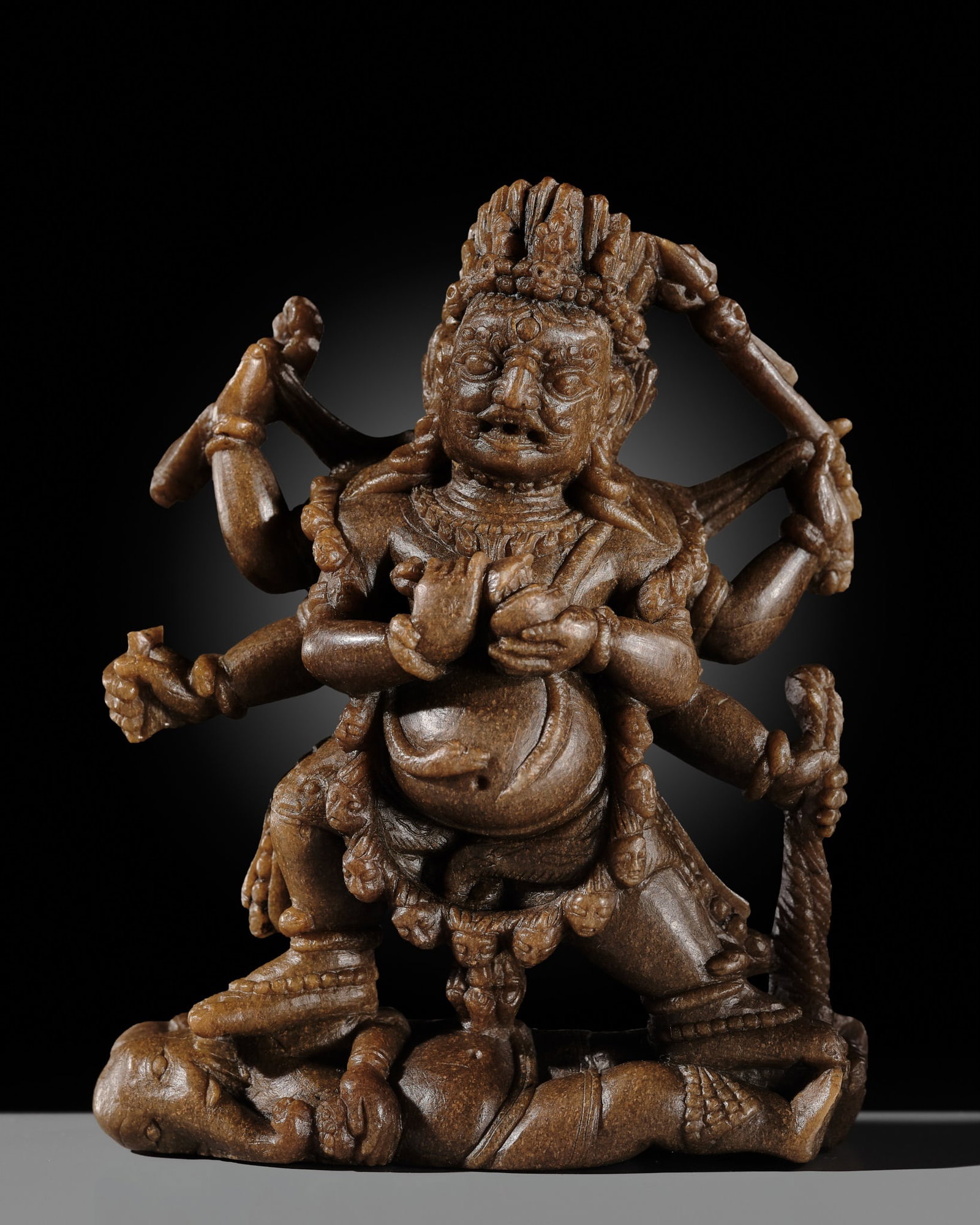 A FINELY CARVED SOAPSTONE FIGURE OF SHADBHUJA MAHAKALA, TIBET, 13TH-14TH CENTURY, EX ULRICH VON (1 of 14)
