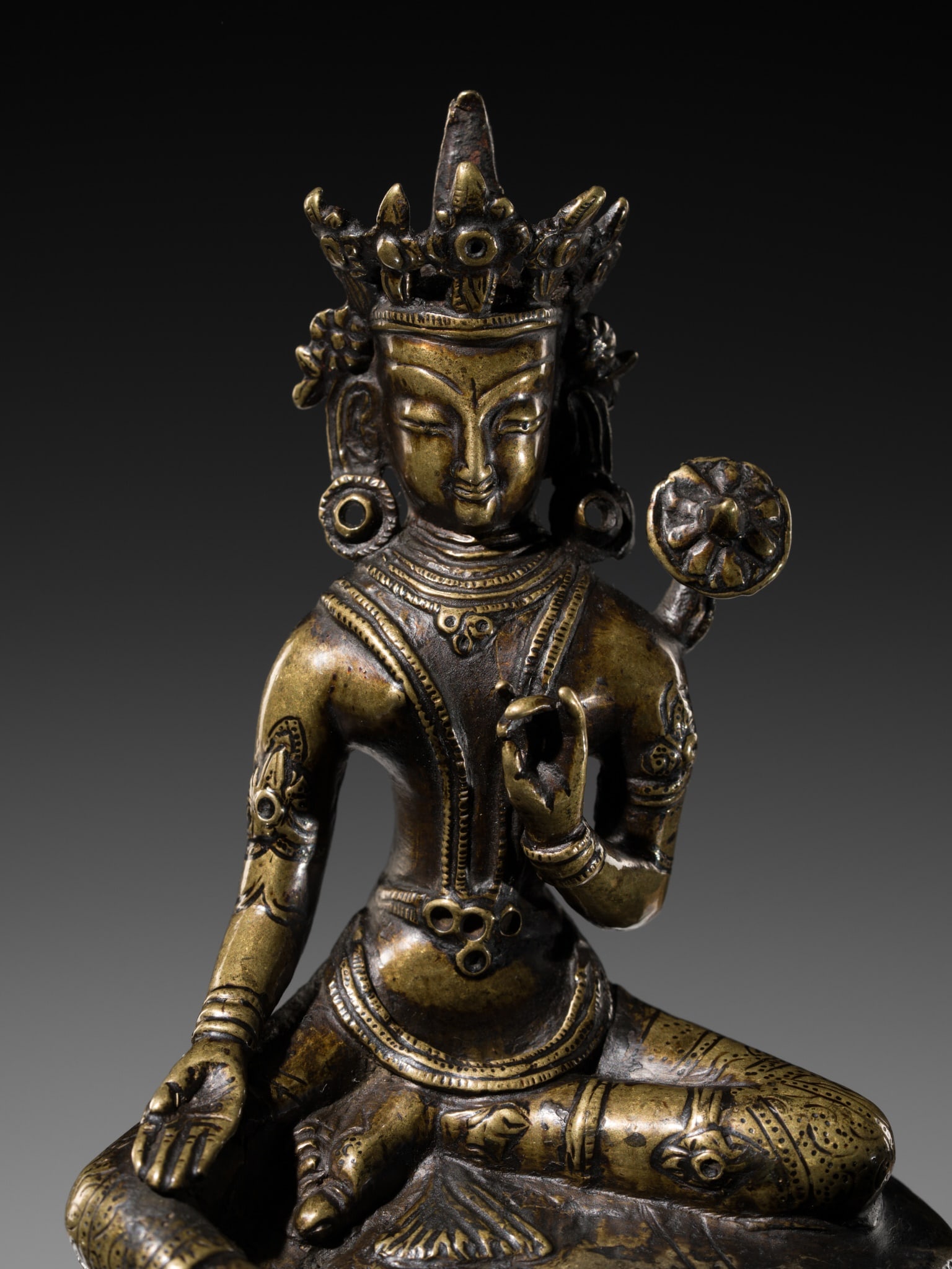 A BRONZE FIGURE OF GREEN TARA, TIBET, CIRCA 15TH-16TH CENTURY (1 of 9)