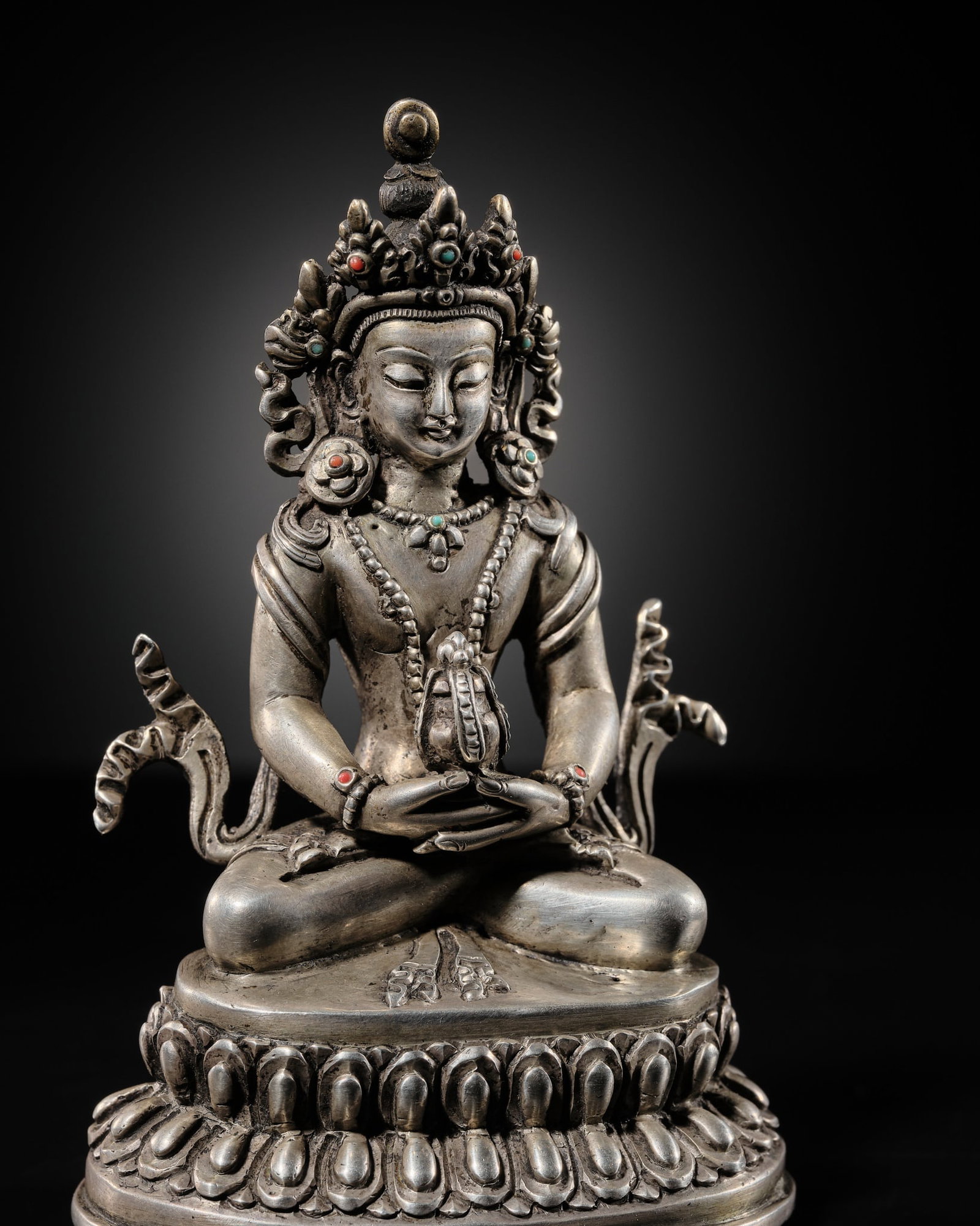 A RARE SILVER FIGURE OF AMITAYUS, TIBET, 17TH-18TH CENTURY (1 of 15)