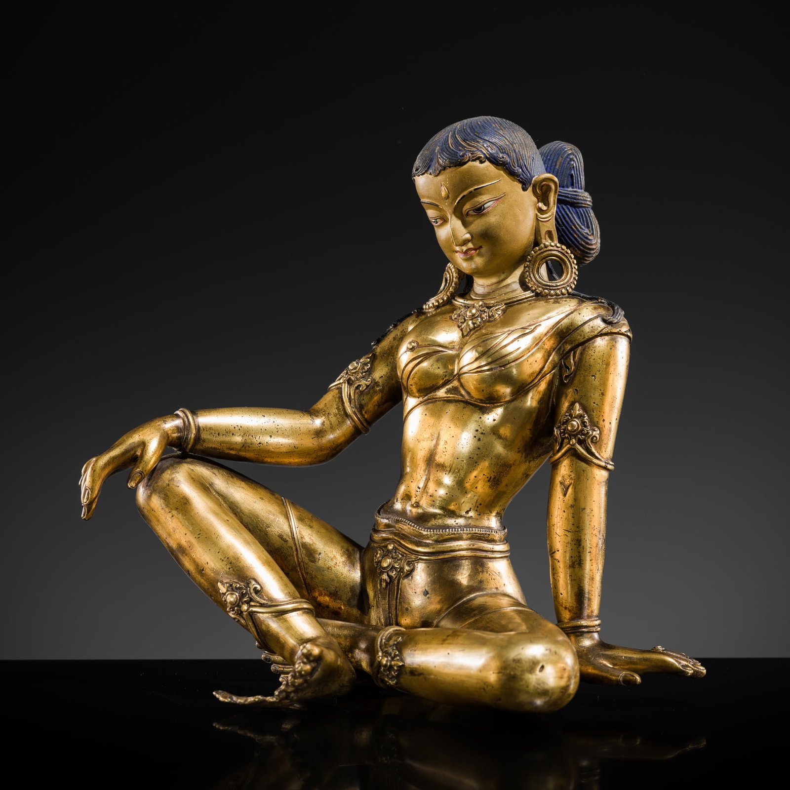 A GILT-BRONZE FIGURE OF PARVATI, NEPAL, PROBABLY 18TH-19TH CENTURY (1 of 12)