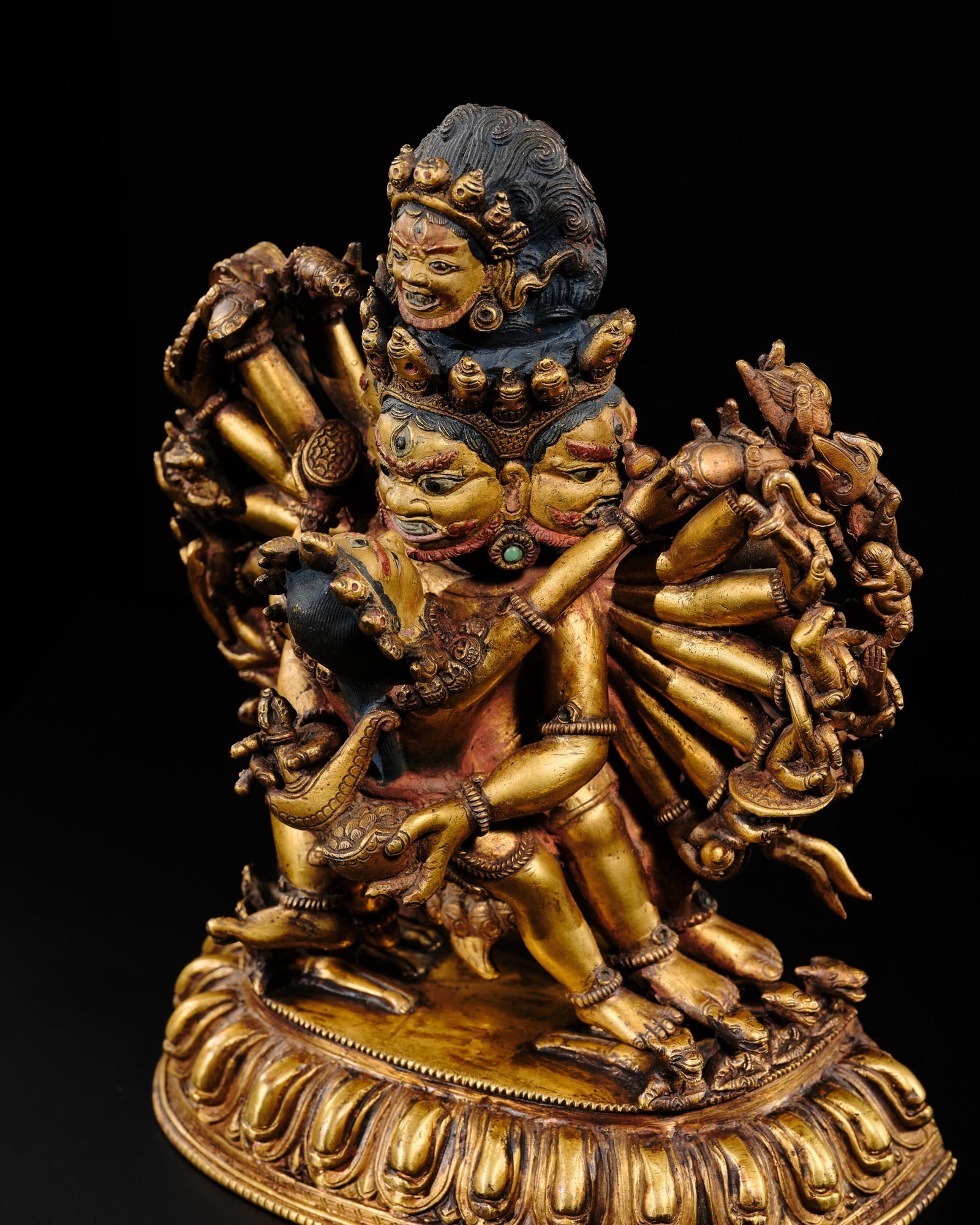 A GILT-BRONZE FIGURE OF PRACHANDA, NEPAL, 19TH-EARLY 20TH CENTURY: A GILT-BRONZE FIGURE OF PRACHANDA, NEPAL, 19TH-EARLY 20TH CENTURY Separately cast in two parts, the pair in yab-yum striding in alidhasana on prostrate animals and figures over a lotus base with beade