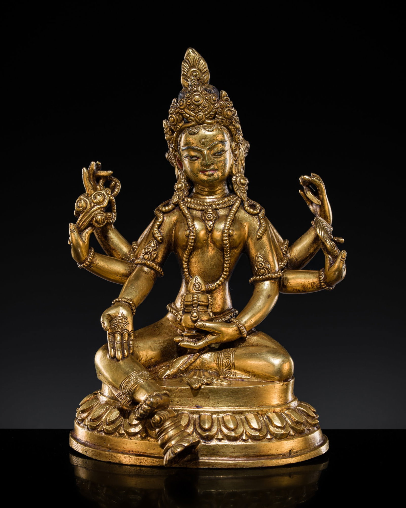A GILT COPPER FIGURE OF VASUDHARA, NEPAL, LATE 19TH-20TH CENTURY (1 of 16)