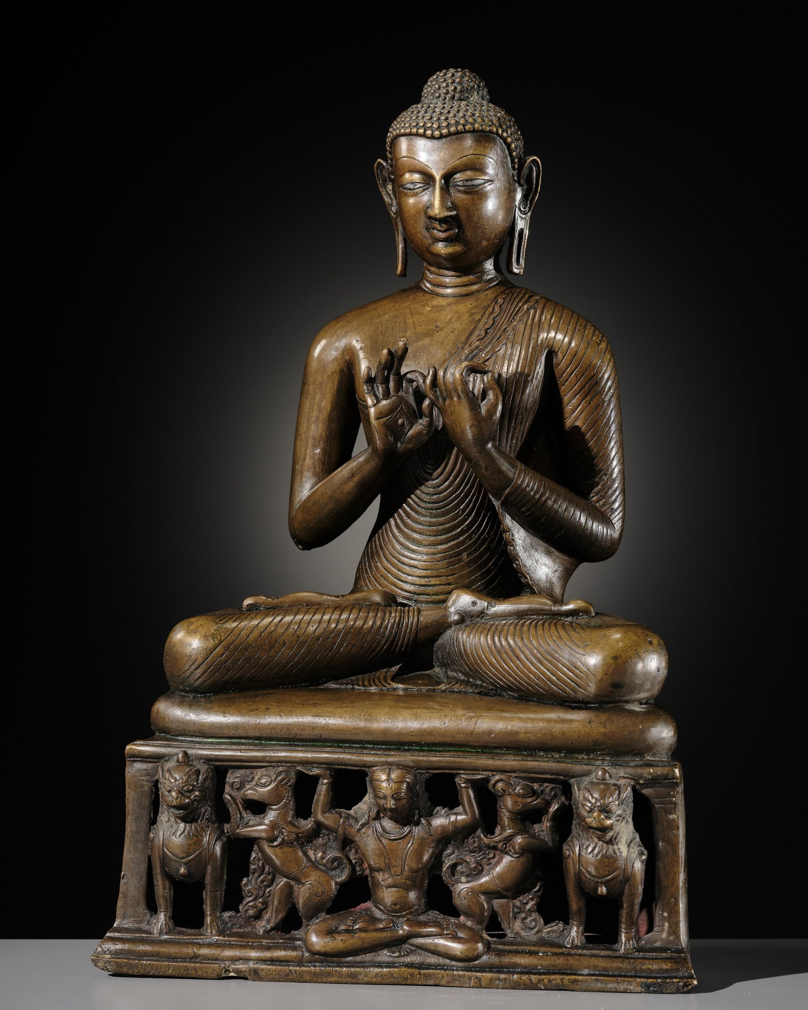 A LARGE SILVER AND COPPER-INLAID BRASS FIGURE OF BUDDHA SHAKYAMUNI, KASHMIR STYLE (1 of 14)