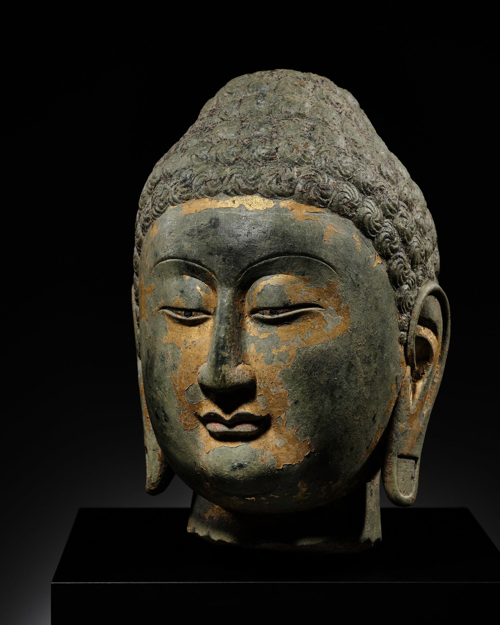 A FINE GILT LIMESTONE HEAD OF BUDDHA, NORTHERN QI DYNASTY (1 of 13)