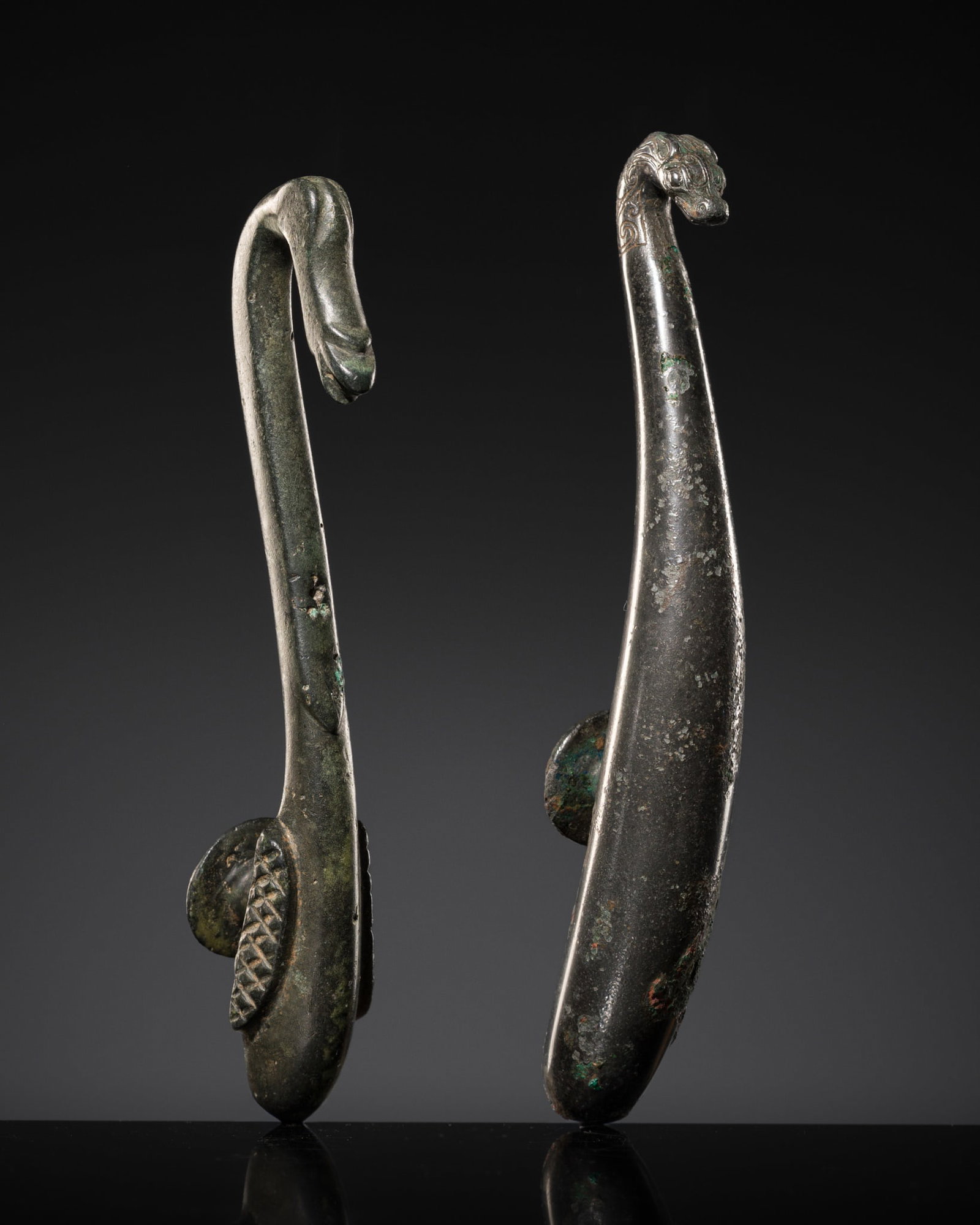 A GROUP OF TWO BRONZE BELT HOOKS, WARRING STATES PERIOD-HAN DYNASTY (1 of 13)