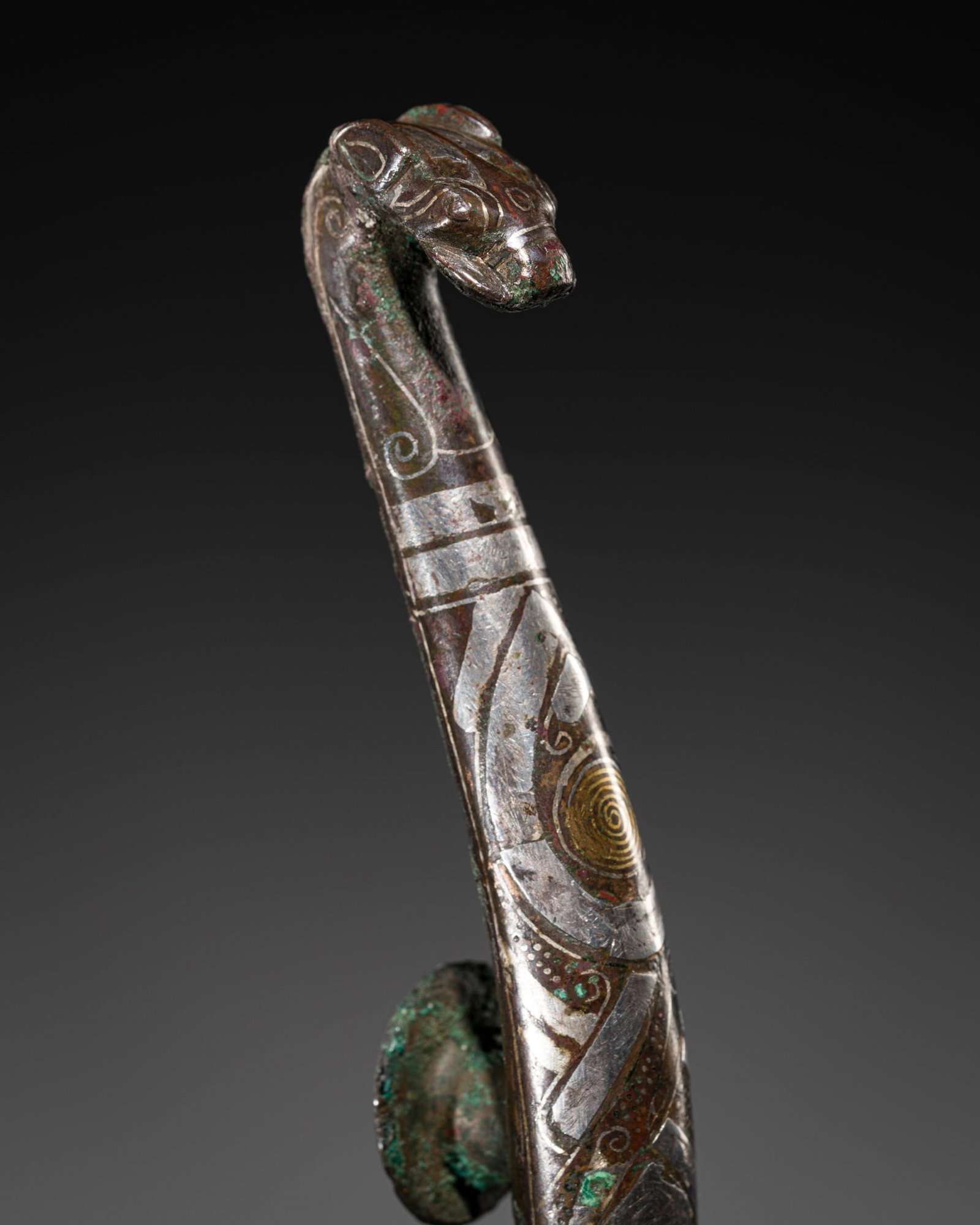 A GOLD AND SILVER-INLAID BRONZE BELT HOOK, WARRING STATES PERIOD-HAN DYNASTY (1 of 12)