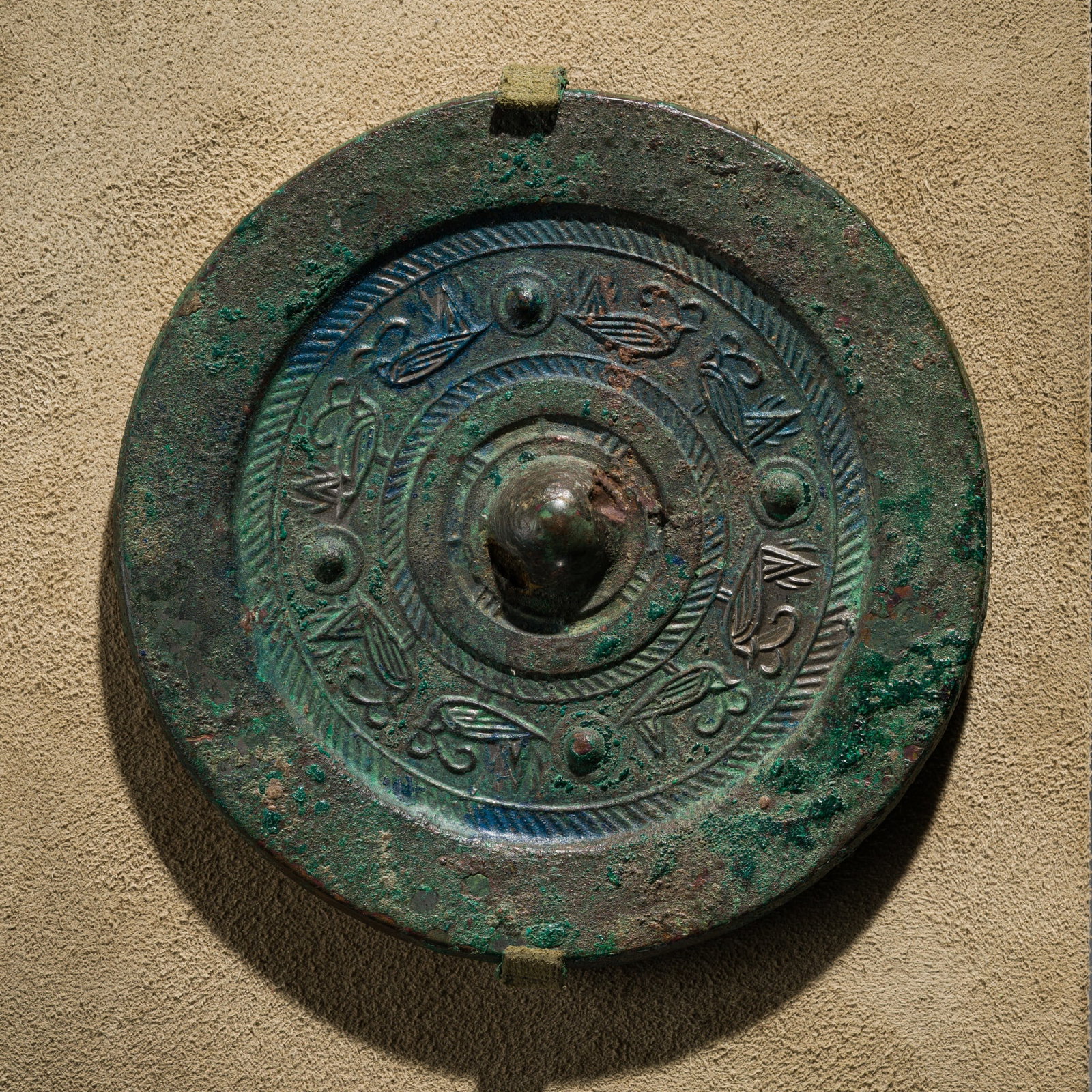 A BRONZE MIRROR WITH PAIRED BIRDS, HAN DYNASTY (1 of 11)