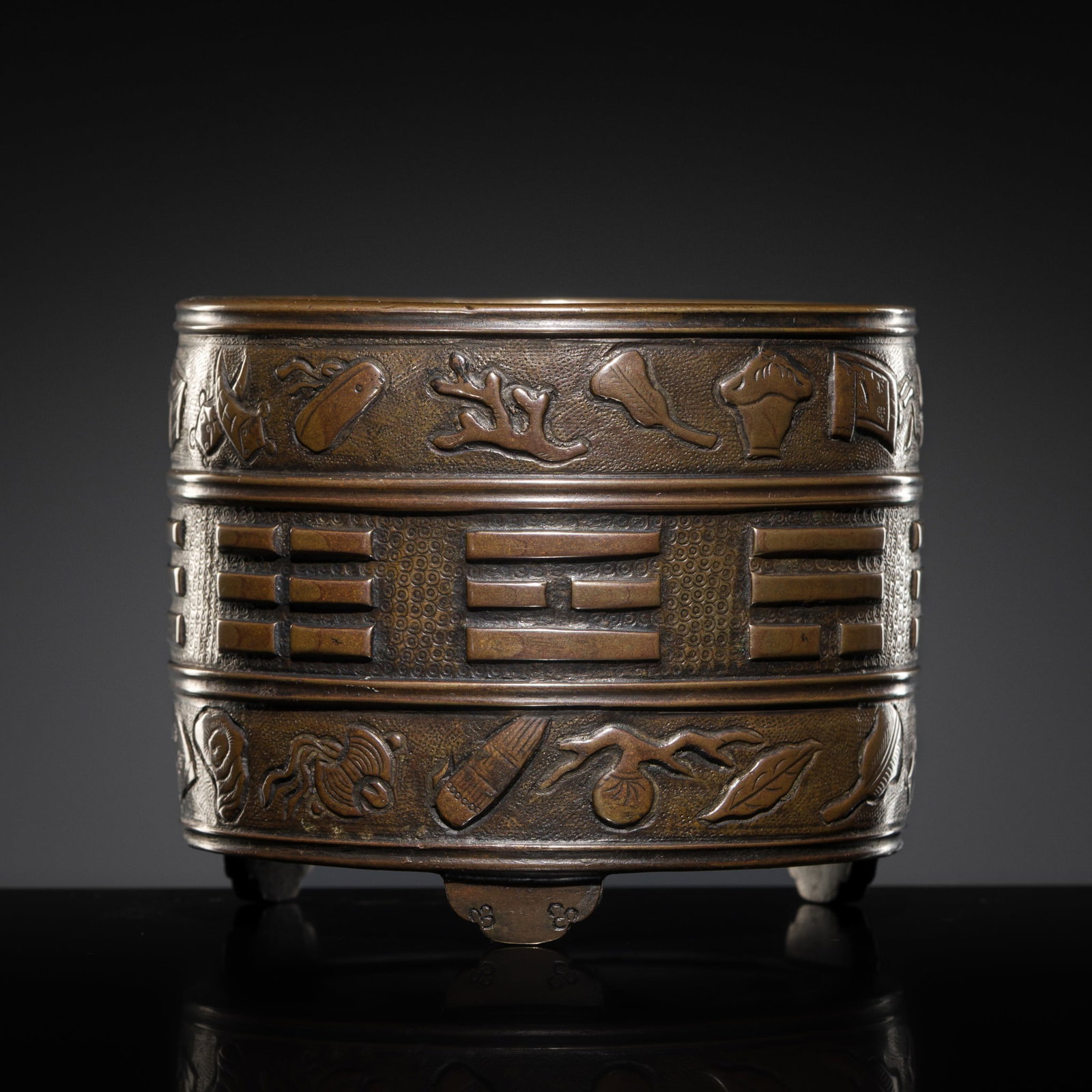 A HU WENMING BRONZE 'BA GUA' TRIPOD INCENSE BURNER, LATE MING TO EARLY QING DYNASTY: A HU WENMING BRONZE 'BA GUA' TRIPOD INCENSE BURNER, LATE MING TO EARLY QING DYNASTY China, 17th century. Finely cast, of cylindrical form, supported on three beast-headed feet and finished with an inc