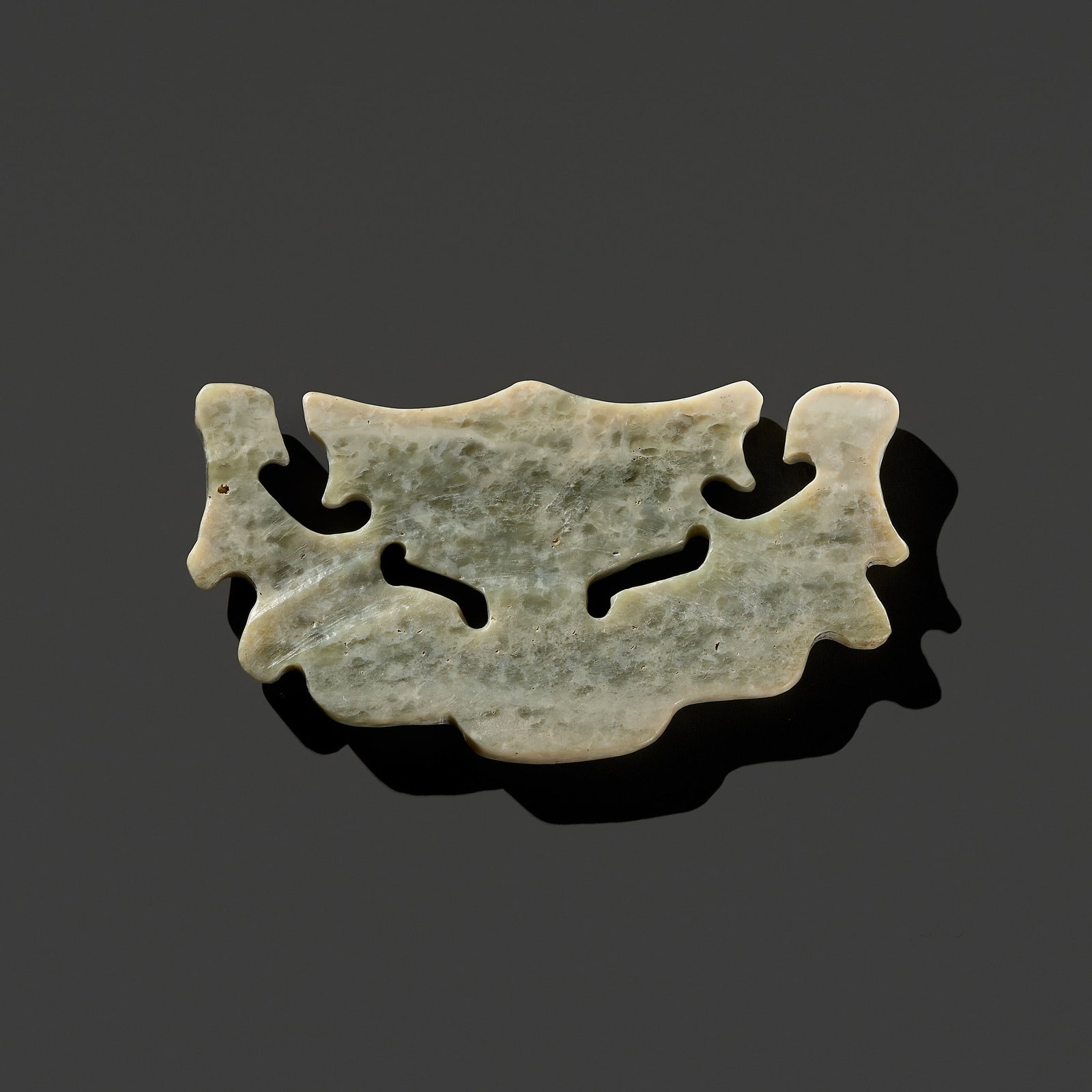 A RARE PALE CELADON JADE 'MASK' PENDANT, LATE NEOLITHIC PERIOD, SHIJIAHE CULTURE (1 of 13)