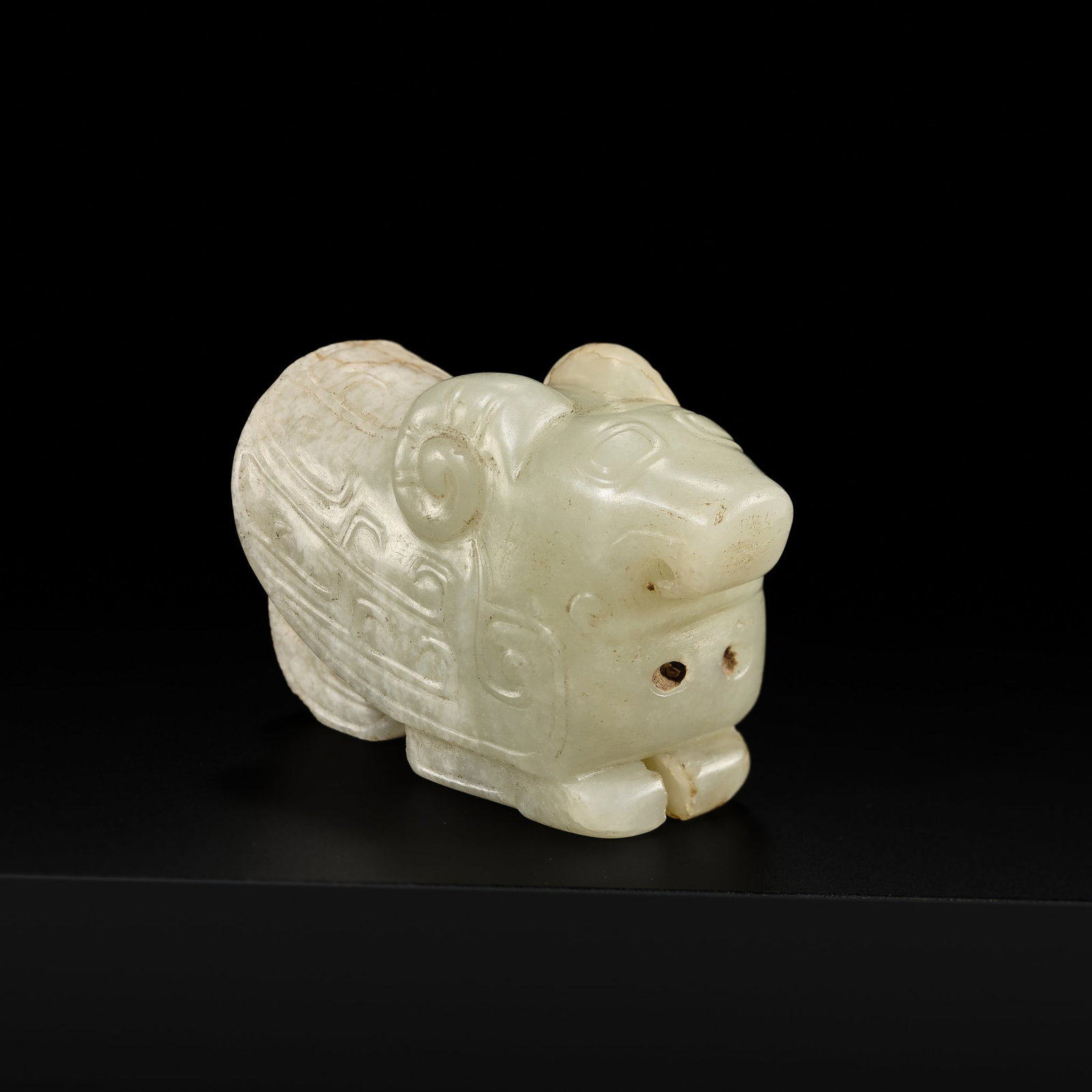 A RARE PALE GREEN JADE CARVING OF AN OWL, WESTERN ZHOU DYNASTY (1 of 13)