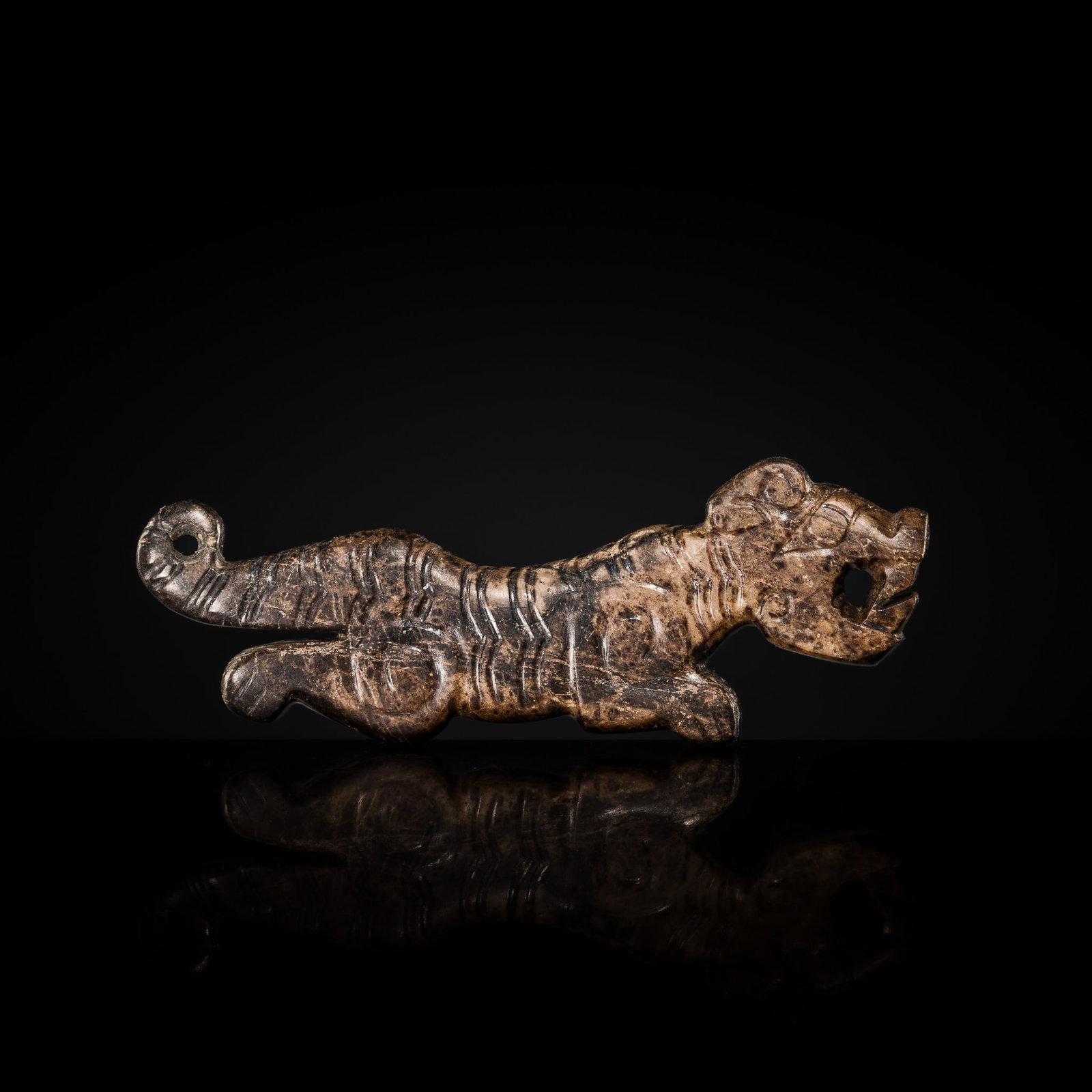 A FINE MOTTLED BROWN JADE 'TIGER' PENDANT, WESTERN ZHOU DYNASTY (1 of 13)