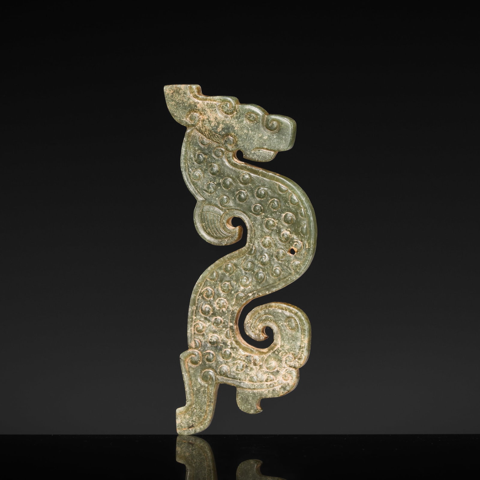 A GREEN JADE DRAGON PENDANT, WARRING STATES PERIOD (1 of 13)
