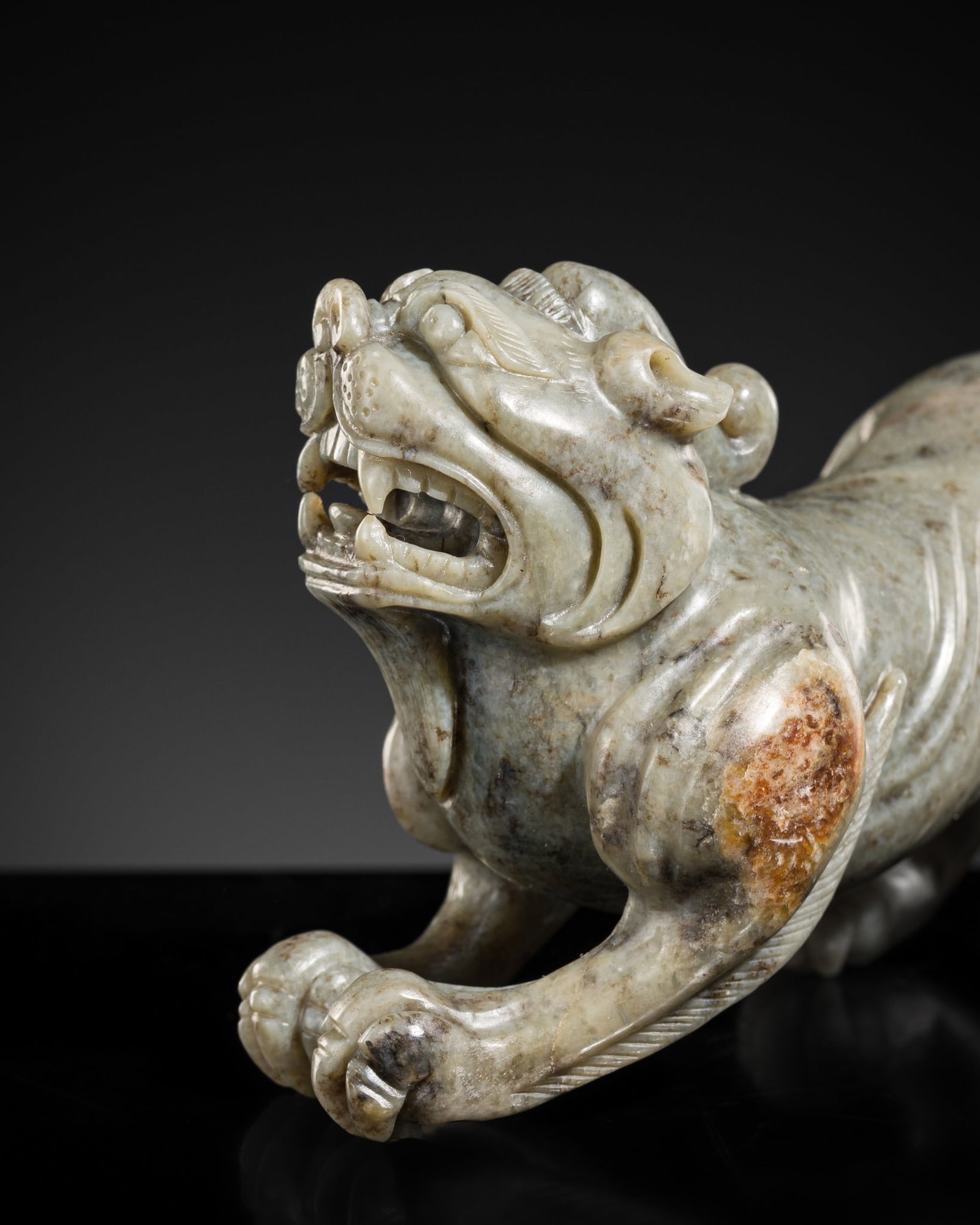 A CELADON JADE FIGURE OF A BIXIE, 17TH-18TH CENTURY (1 of 8)