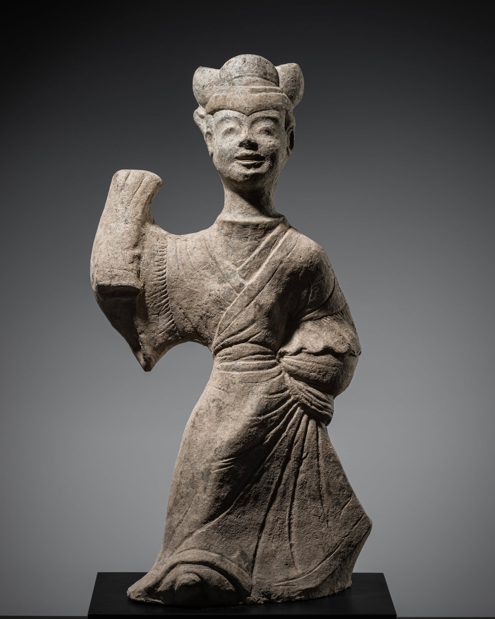 A POTTERY FIGURE OF A FEMALE DANCER, EASTERN HAN DYNASTY (1 of 12)