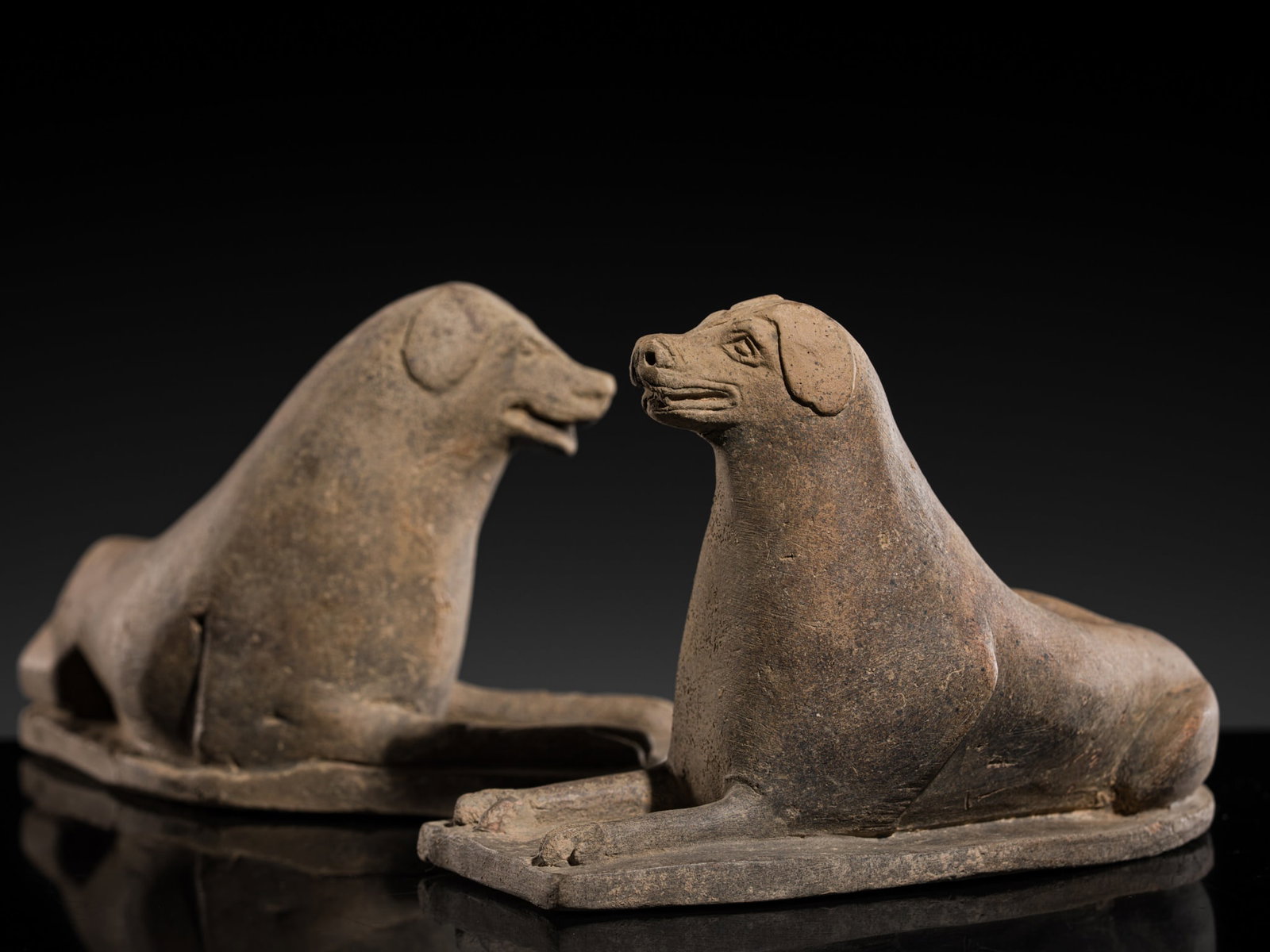 A PAIR OF PAINTED GRAY POTTERY FIGURES OF SEATED HOUNDS, NORTHERN WEI DYNASTY (1 of 14)