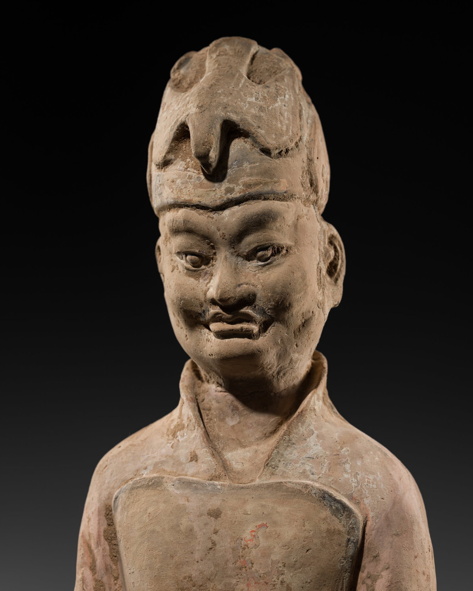 A LARGE PAINTED POTTERY FIGURE OF A COURT OFFICIAL, TANG DYNASTY (1 of 16)