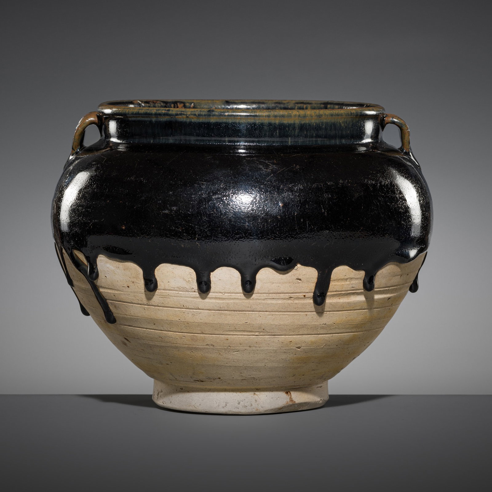 A CIZHOU BLACK-GLAZED POTTERY JAR, SONG DYNASTY: A CIZHOU BLACK-GLAZED POTTERY JAR, SONG DYNASTY Published and Exhibited: Ben Janssens Oriental Art, Early Ceramics, London, 1997, cat. no. 7. Ben Janssens Oriental Art, TEFAF Maastricht, 11-20 March 2