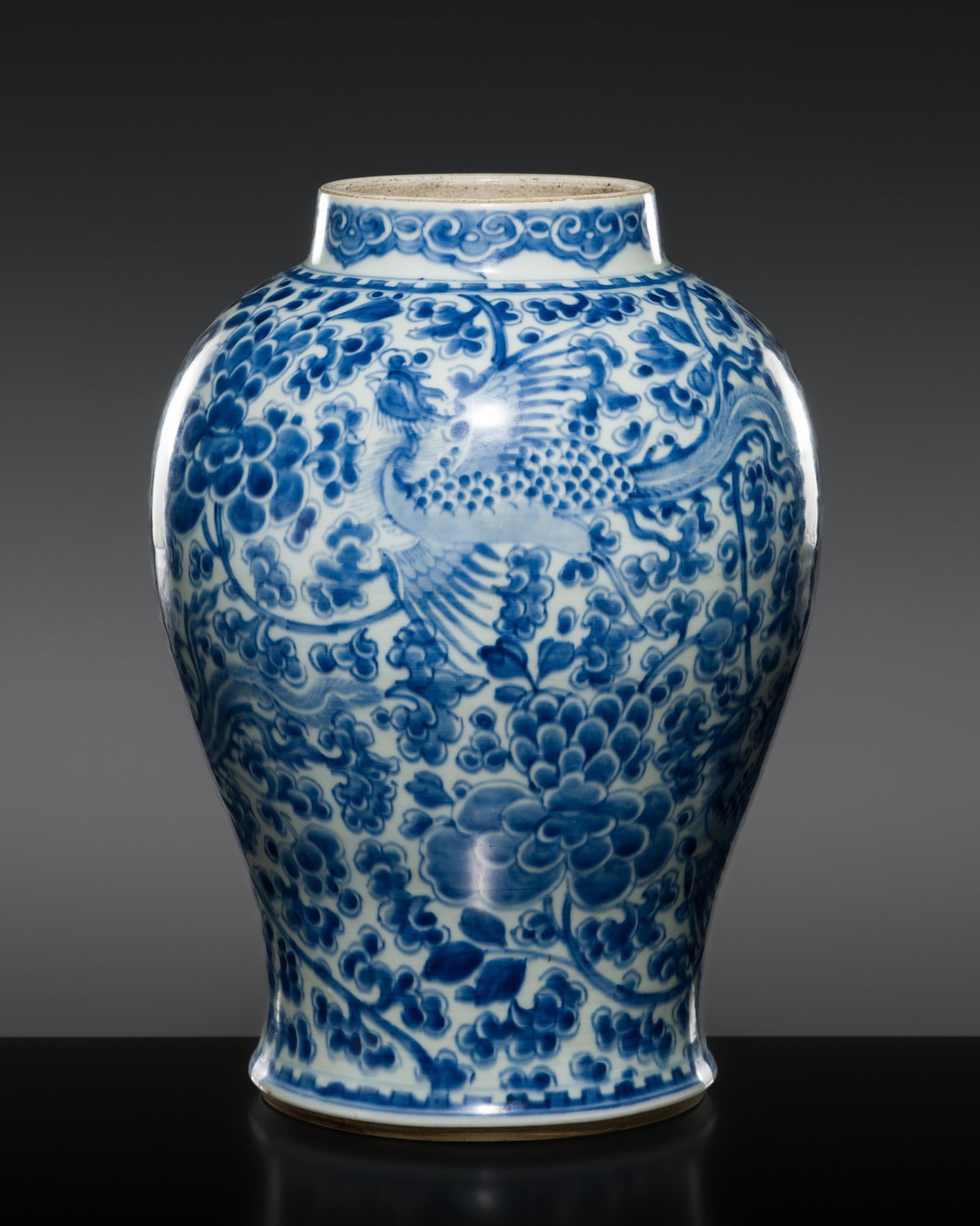 A FINE BLUE AND WHITE 'PHOENIX' BALUSTER VASE, KANGXI PERIOD: † A FINE BLUE AND WHITE 'PHOENIX' BALUSTER VASE, KANGXI PERIOD China, 1662-1722. The baluster body is supported on a short ring foot and rises over broad shoulders to a gently tapered neck. Fine