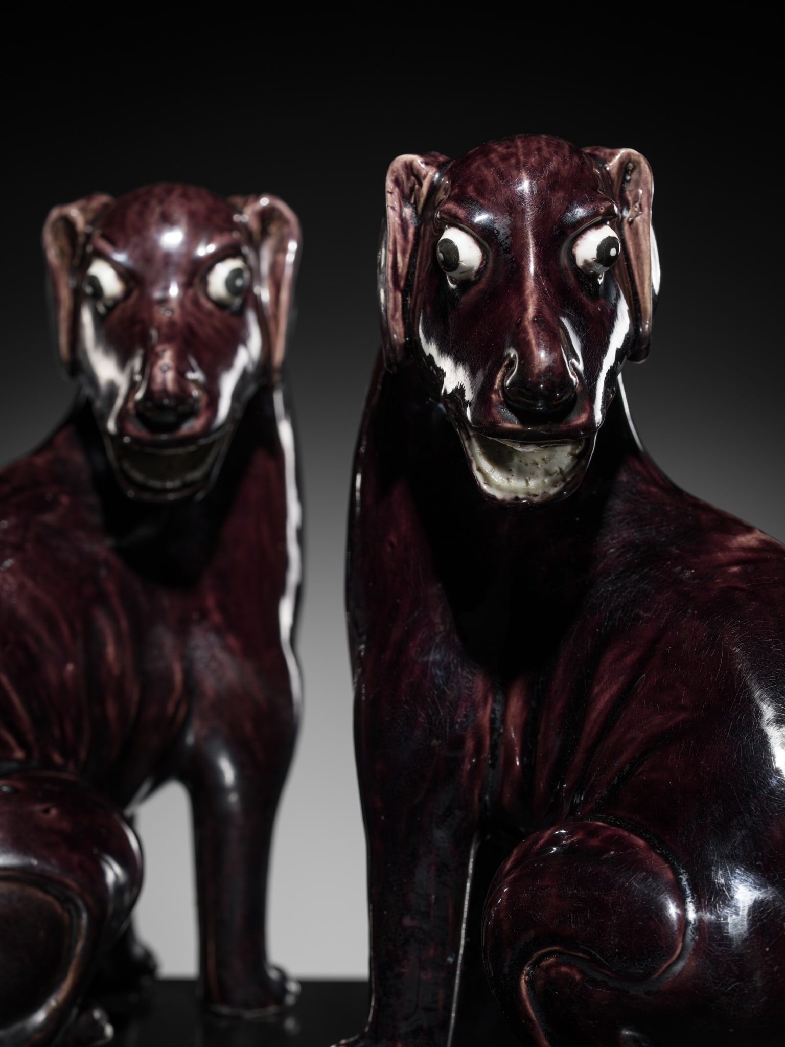 A RARE PAIR OF AUBERGINE-GLAZED FIGURES OF HOUNDS, KANGXI PERIOD (1 of 14)