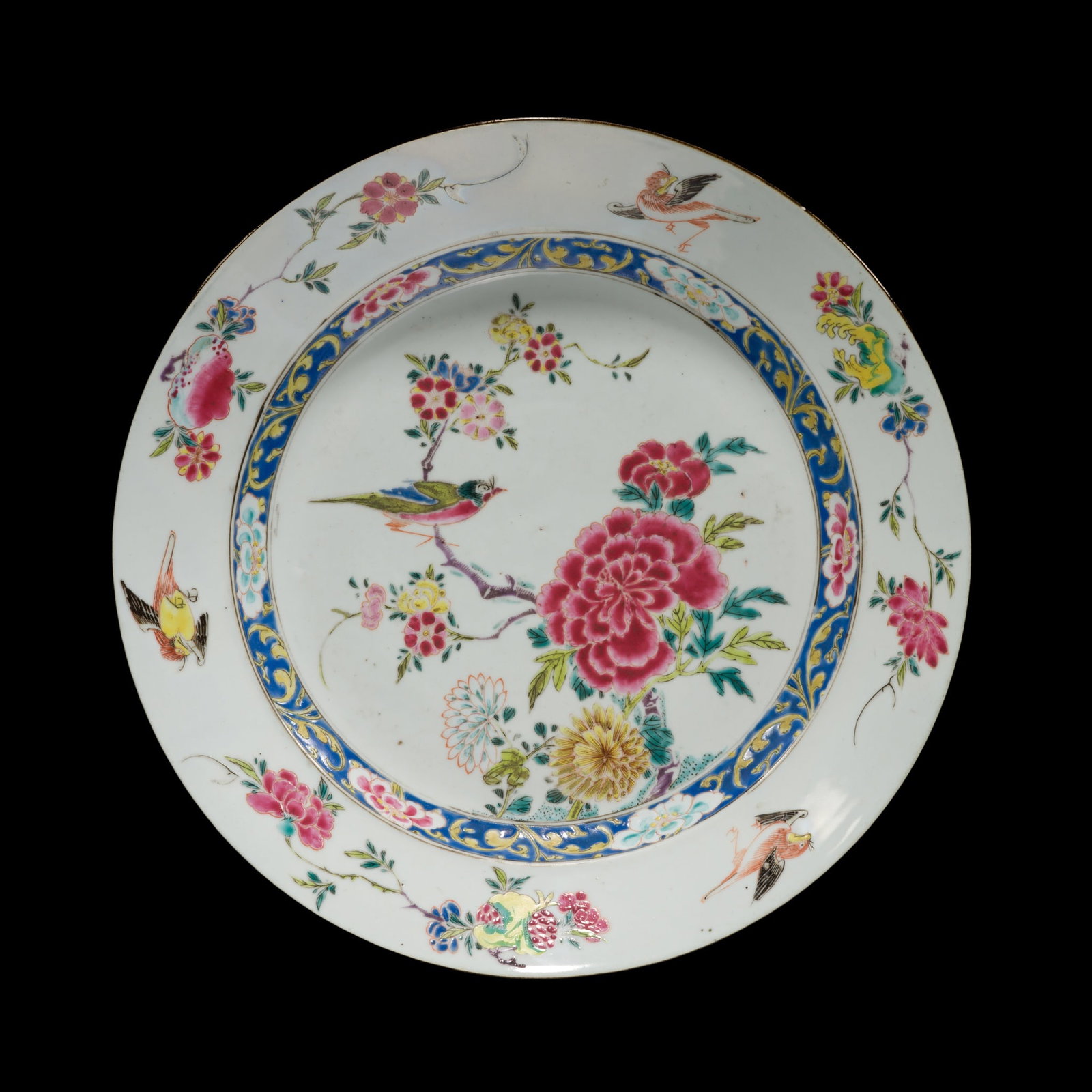 A LARGE FAMILLE ROSE 'BIRD AND FLOWER' DISH, YONGZHENG PERIOD: A LARGE FAMILLE ROSE 'BIRD AND FLOWER' DISH, YONGZHENG PERIOD China, 1722-1735. Finely potted with shallow, rounded sides rising from a short ring foot to a broad, everted rim, the interior is delicat