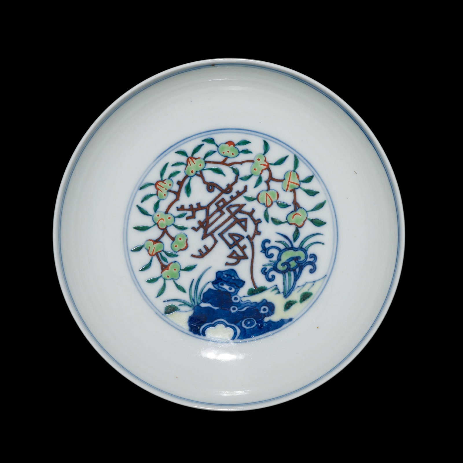 A MING-STYLE DOUCAI 'LONGEVITY' DISH, QIANLONG MARK AND PROBABLY OF THE PERIOD: A MING-STYLE DOUCAI 'LONGEVITY' DISH, QIANLONG MARK AND PROBABLY OF THE PERIOD China, probably 1736-1795. The dish is decorated to the interior with a central medallion depicting a fruiting peach tree