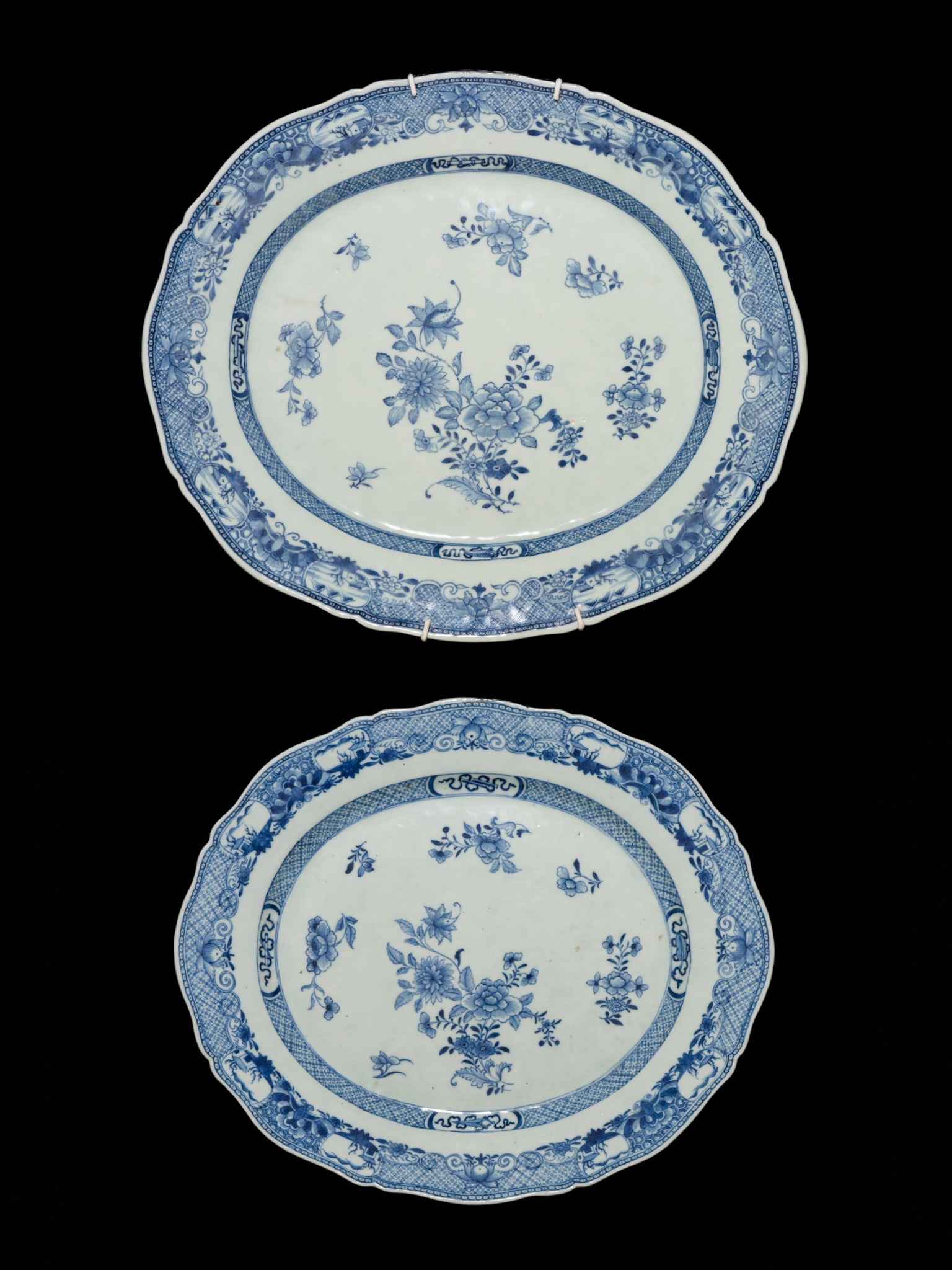 A GROUP OF TWO BLUE AND WHITE FOLIATE OVAL 'CHRYSANTHEMUM AND PEONY' SERVING DISHES, QIANLONG PERIOD (1 of 12)