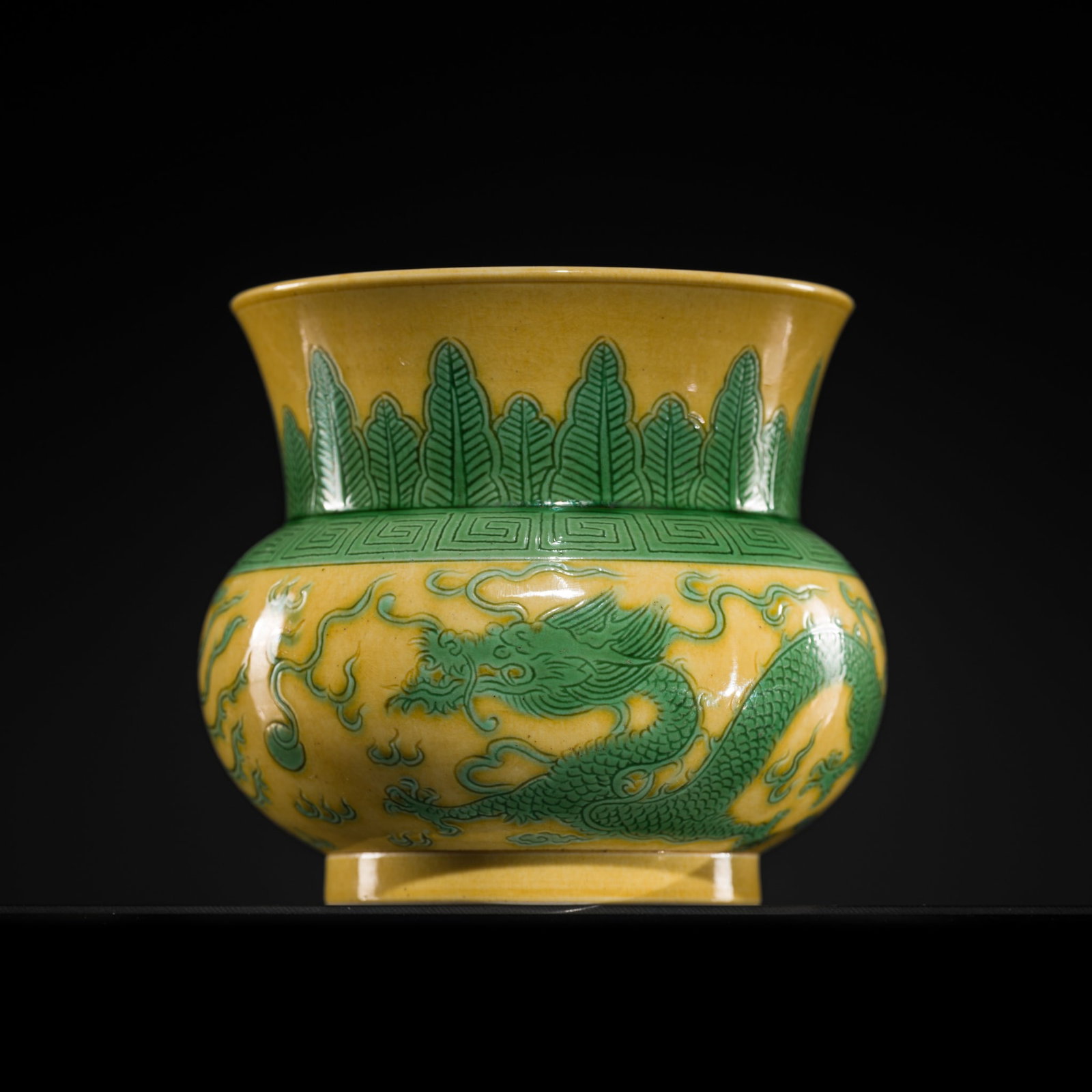A RARE INCISED YELLOW-GROUND GREEN-ENAMELED ZHADOU, JIAQING MARK AND PERIOD: † A RARE INCISED YELLOW-GROUND GREEN-ENAMELED ZHADOU, JIAQING MARK AND PERIOD China, 1796-1820. The globular body rising from a straight foot to a trumpet neck, incised and highlighted in green 
