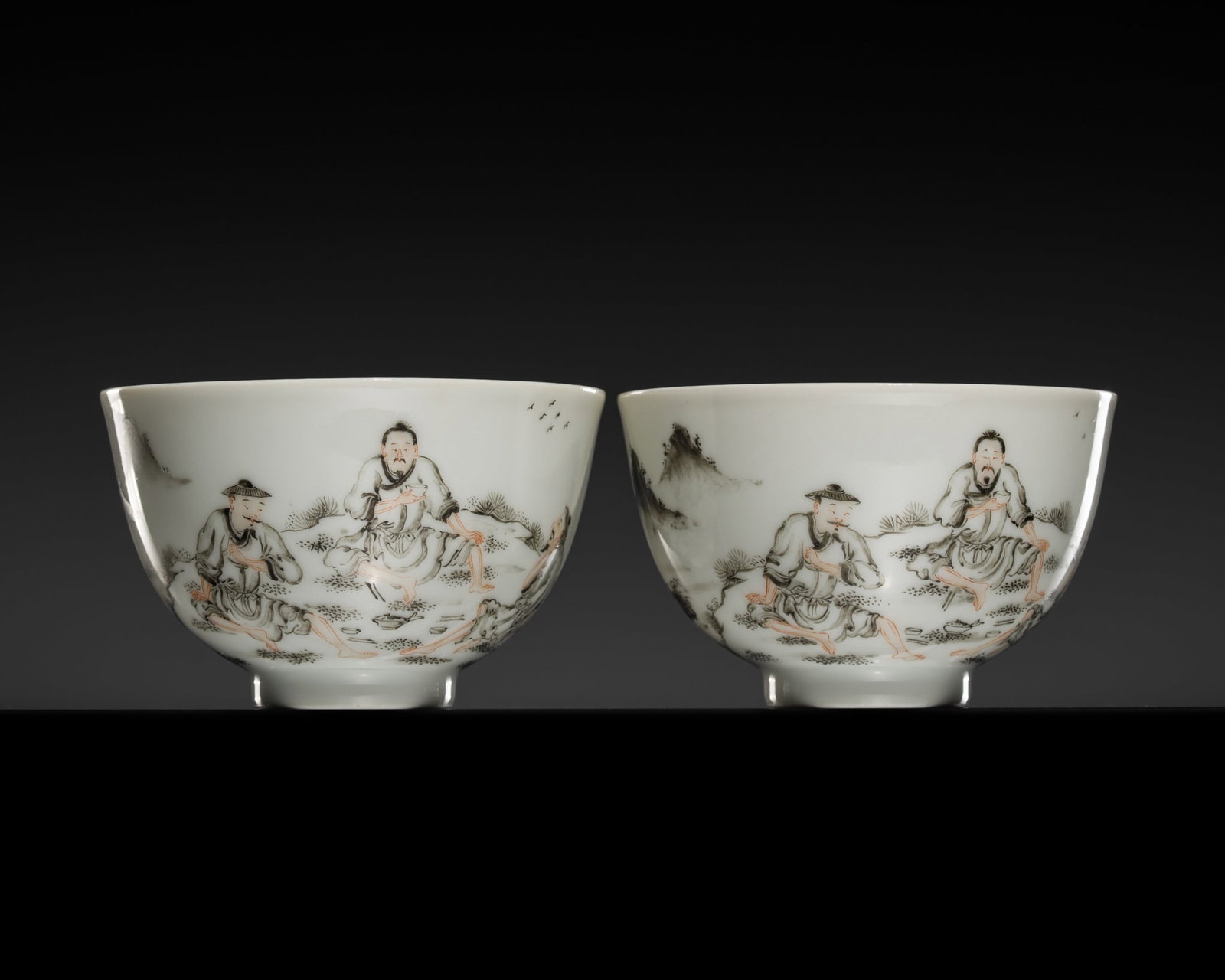 A FINE PAIR OF GRISAILLE DECORATED CUPS, GENGDU SHANFANG MARK, LATE QING DYNASTY: † A FINE PAIR OF GRISAILLE DECORATED CUPS, GENGDU SHANFANG MARK, LATE QING DYNASTY China, late 19th century. Each delicately potted, the deep sides rising from a short foot, finely painted in gr