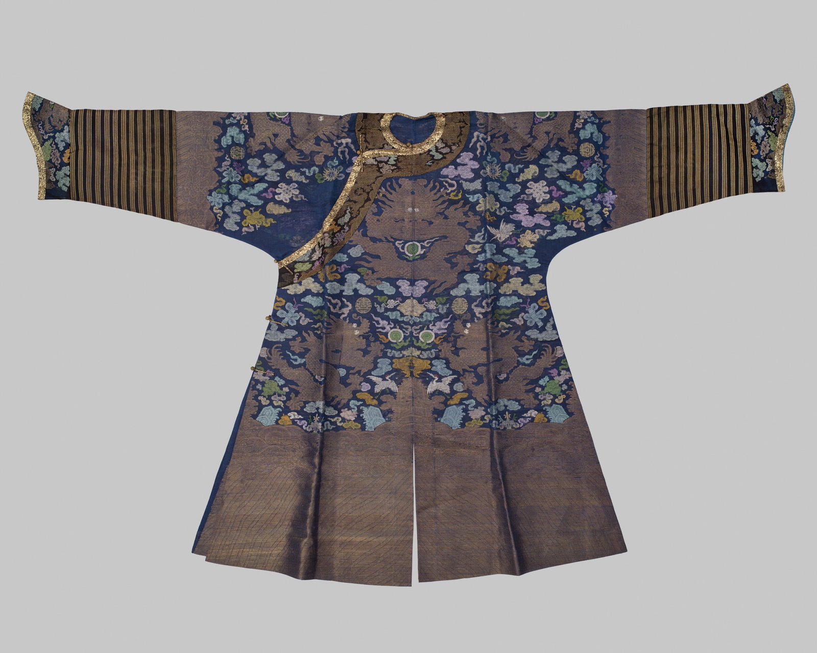 AN EMBROIDERED BLUE SILK GAUZE 'DRAGON' ROBE, MANGPAO, LATE QING DYNASTY (1 of 17)