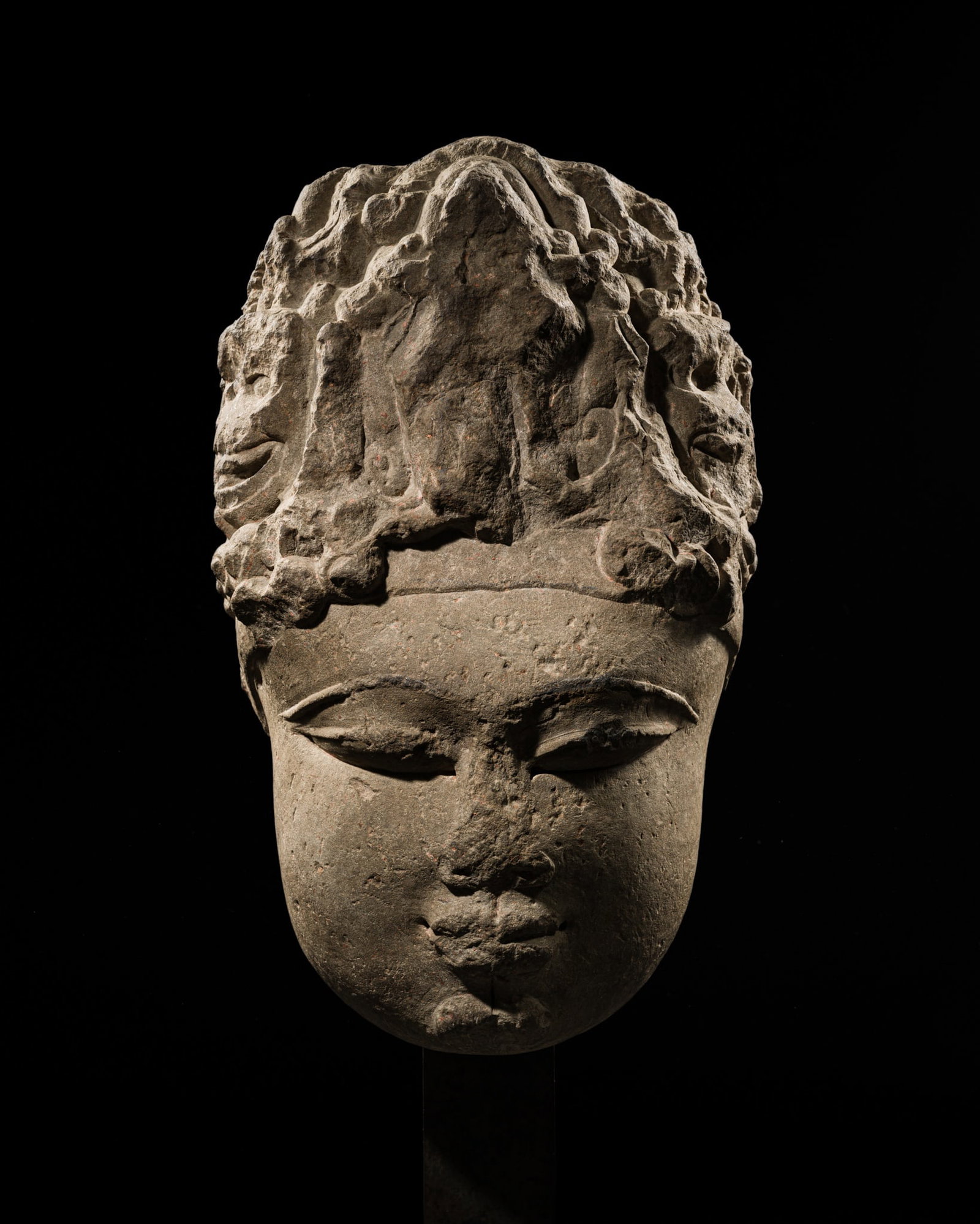 A RARE MONUMENTAL BUFF SANDSTONE HEAD OF DEVI, UTTAR PRADESH, 9TH-10TH CENTURY (1 of 13)