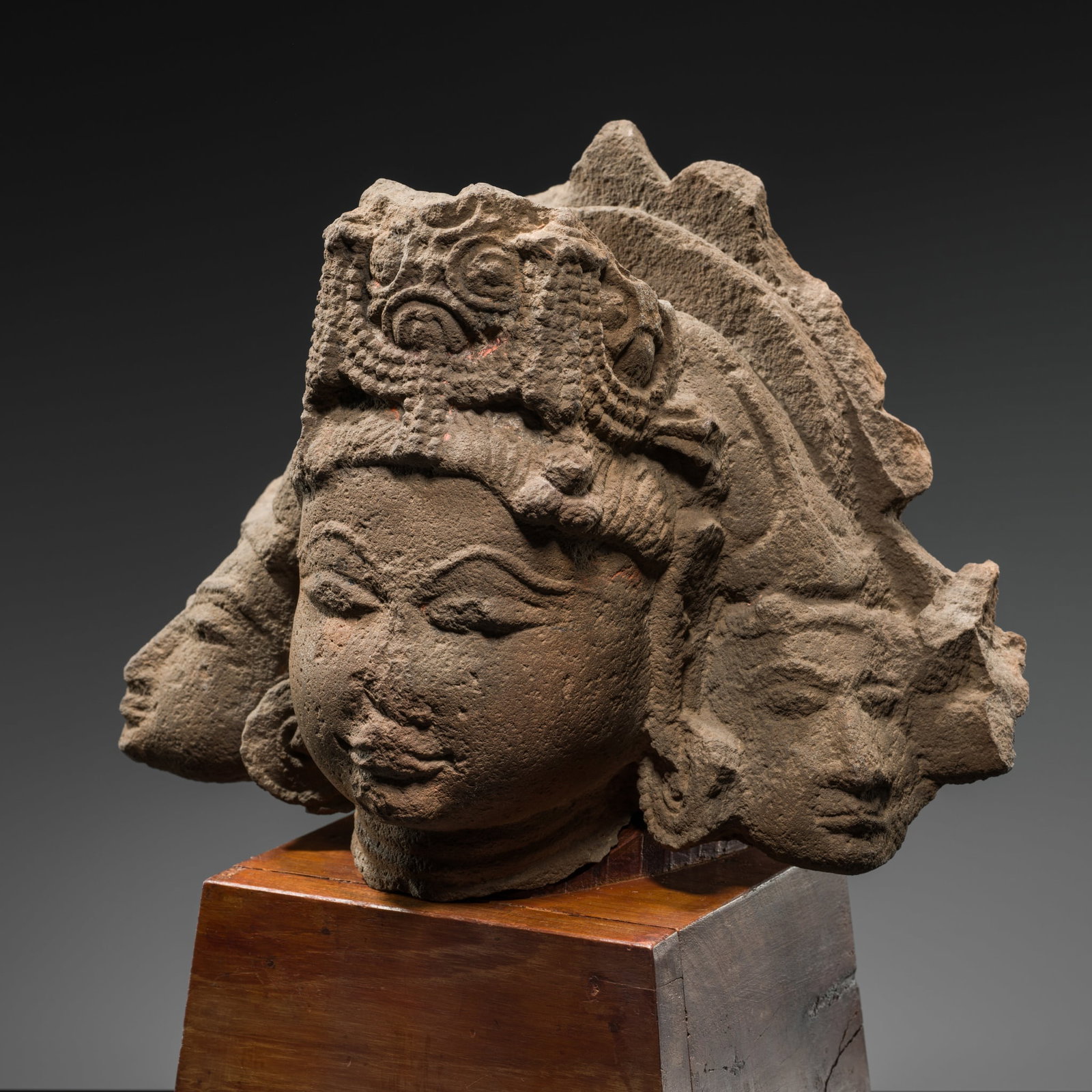 A RED SANDSTONE HEAD OF BRAHMA TRIMURTI, RAJASTHAN OR MADHYA PRADESH, 10TH-11TH CENTURY (1 of 12)