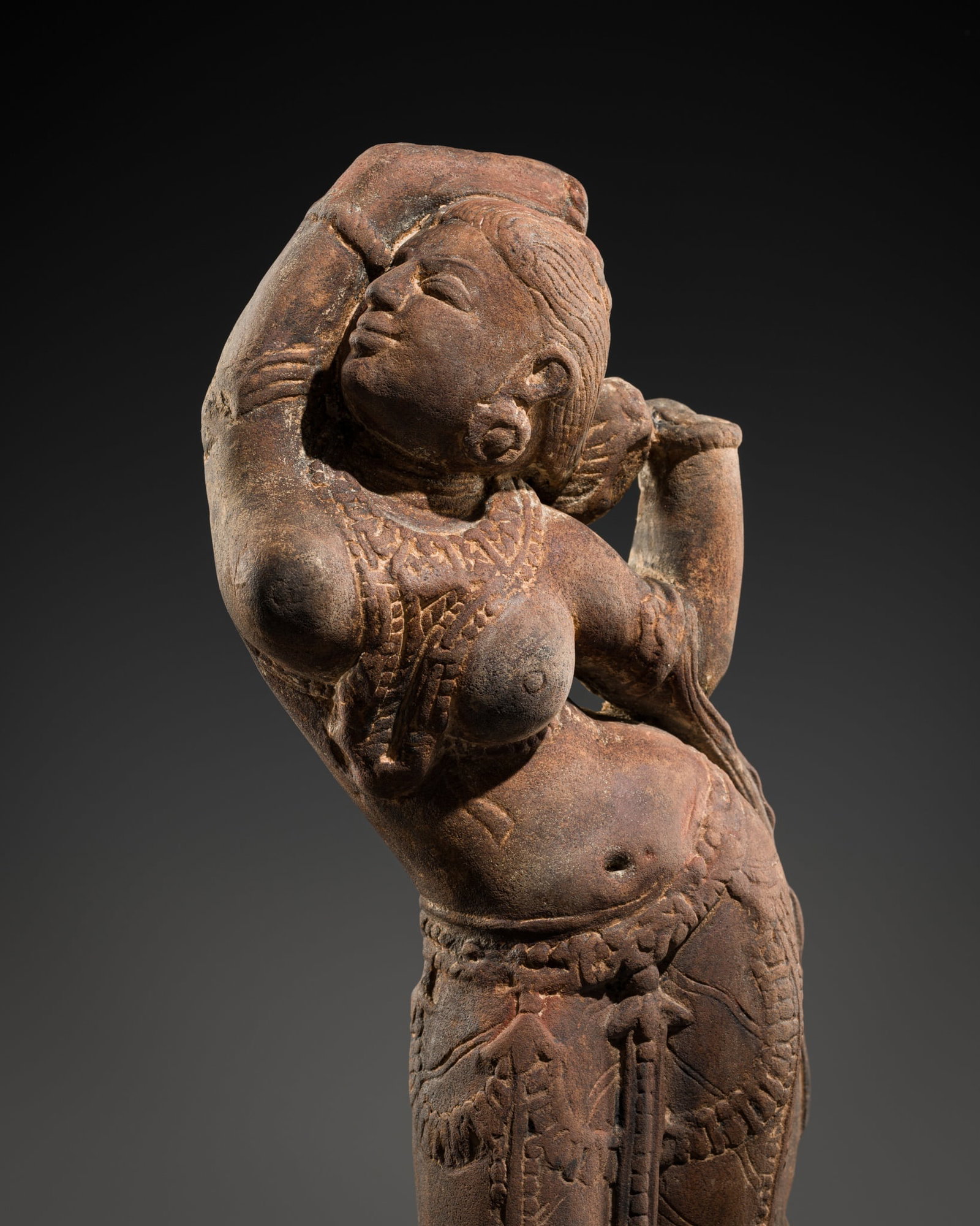A RED SANDSTONE FIGURE OF A CELESTIAL WOMAN, RAJASTHAN, 11TH-12TH CENTURY (1 of 12)