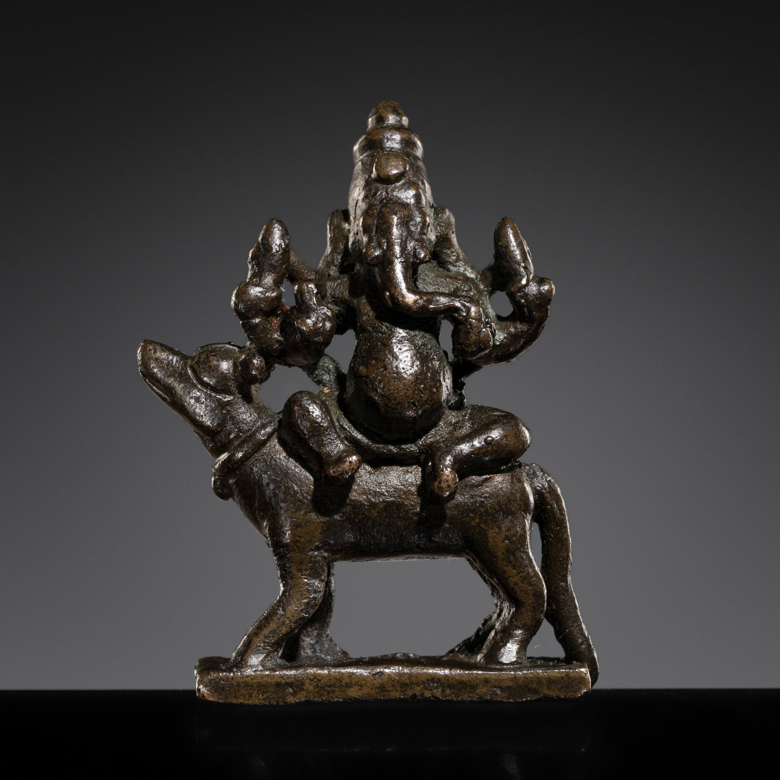 A SMALL BRONZE FIGURE OF GANESHA ON HIS RAT VAHANA, SOUTH INDIA, CIRCA 16TH CENTURY (1 of 10)