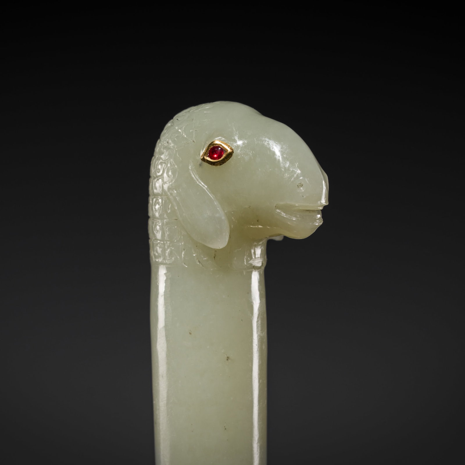 A MUGHAL RUBY-INLAID PALE CELADON JADE 'SHEEP' HILT, 18TH-19TH CENTURY (1 of 10)