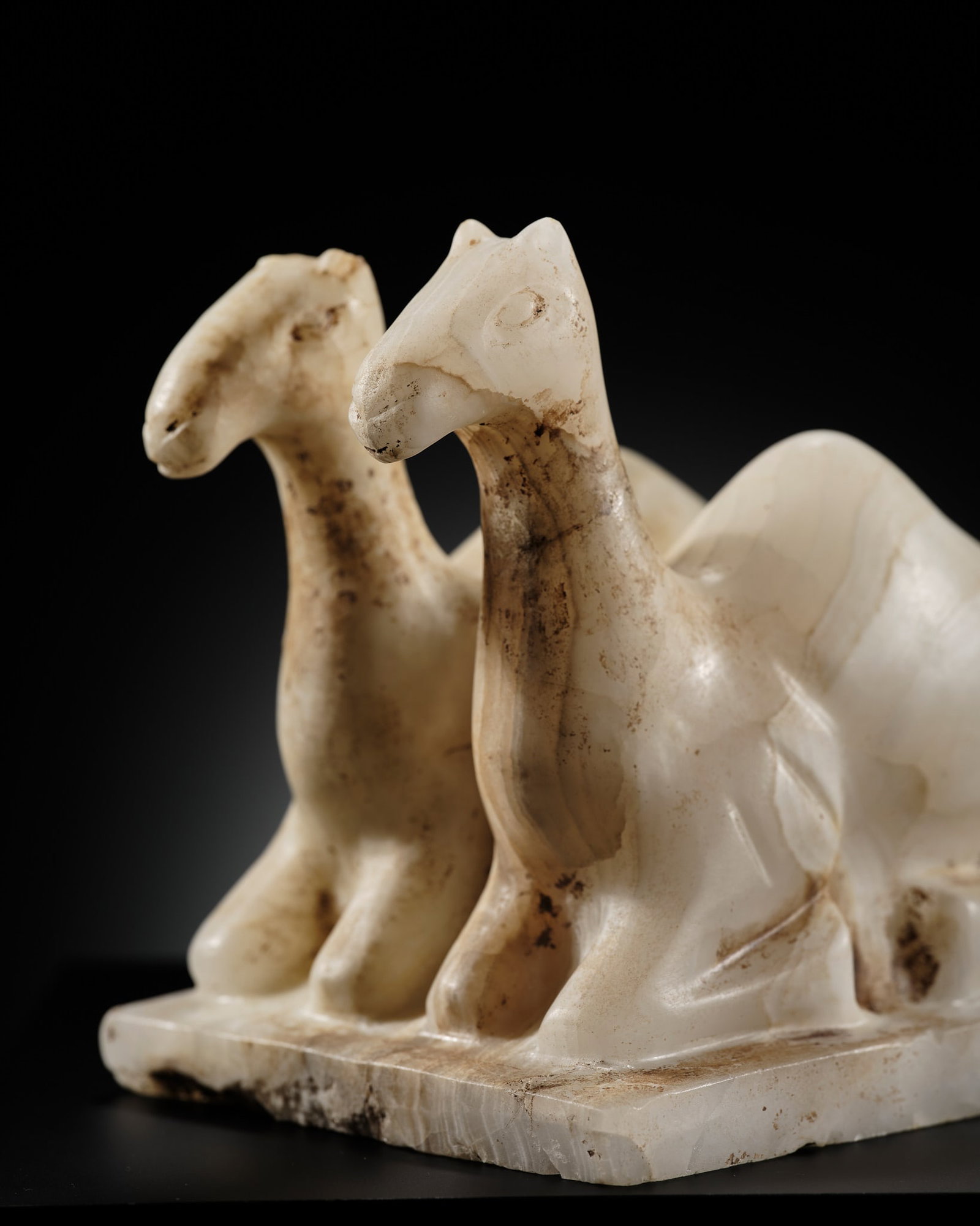 A SOUTH ARABIAN ALABASTER 'CAMEL' VOTIVE FIGURE, CIRCA 3RD-1ST CENTURY BC (1 of 13)