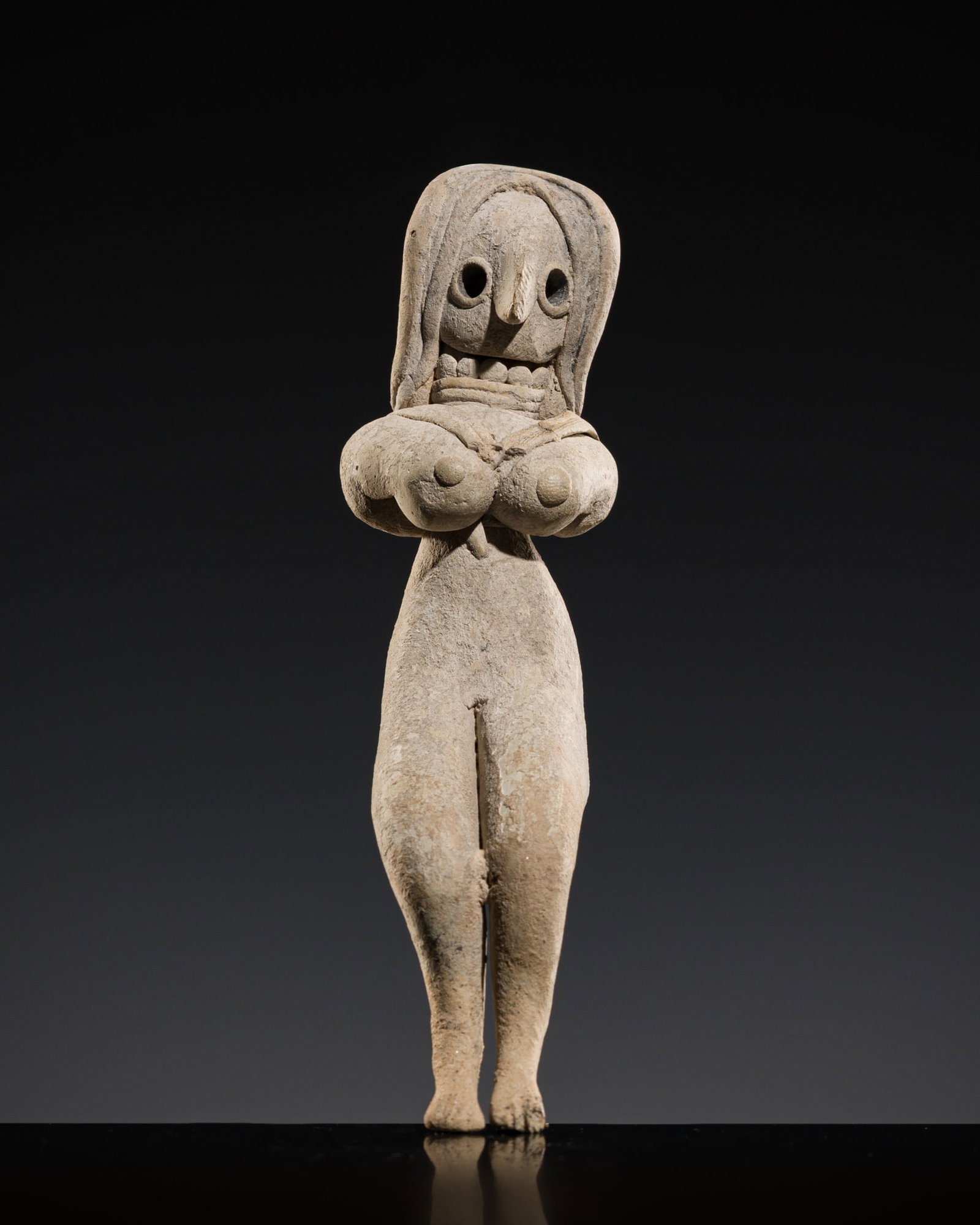 A MEHRGARH TERRACOTTA FIGURE OF A SEATED MOTHER GODDESS, INDUS VALLEY CIVILIZATION (1 of 10)