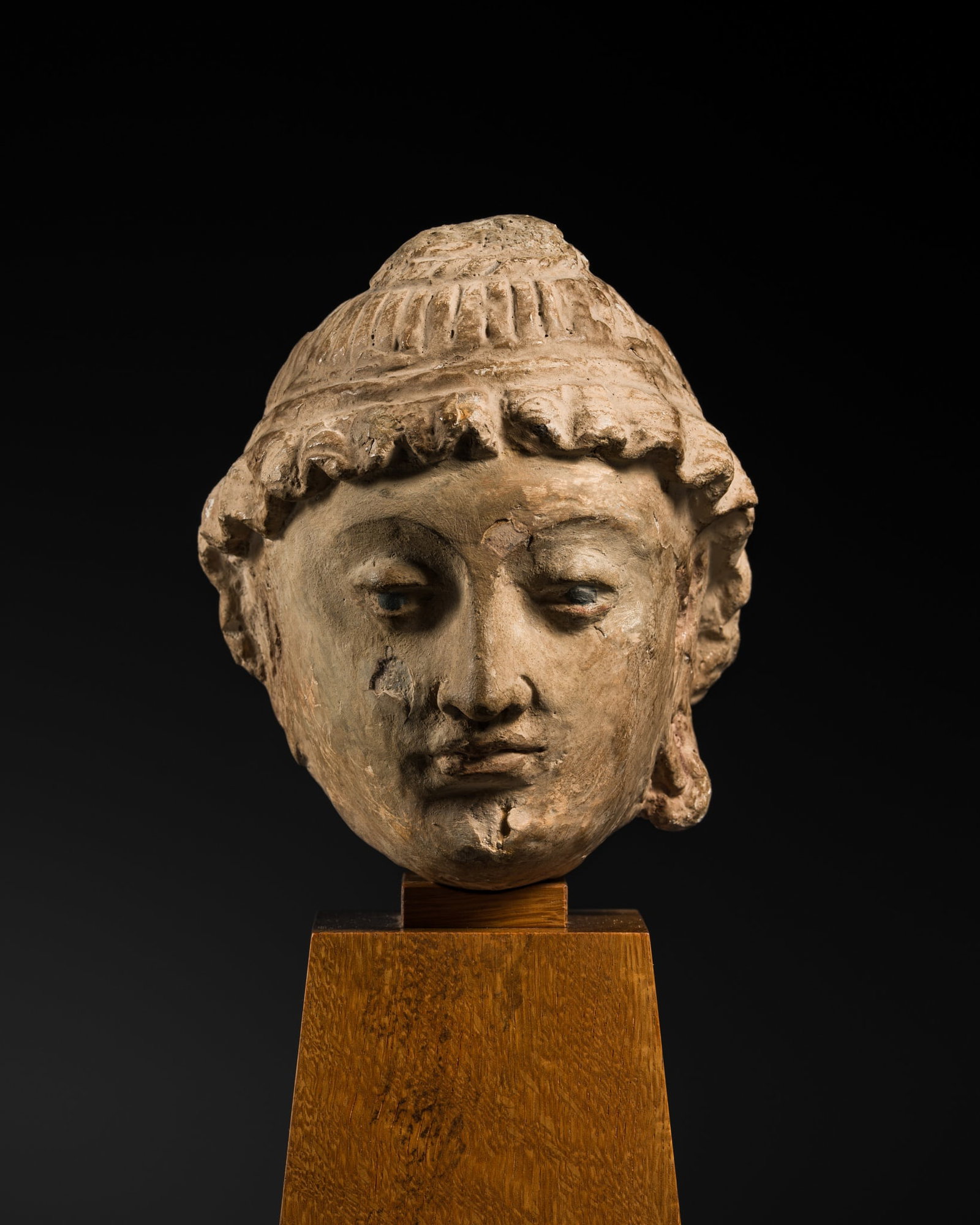 A POLYCHROME STUCCO HEAD OF A BODHISATTVA, ANCIENT REGION OF GANDHARA, 4TH CENTURY (1 of 12)