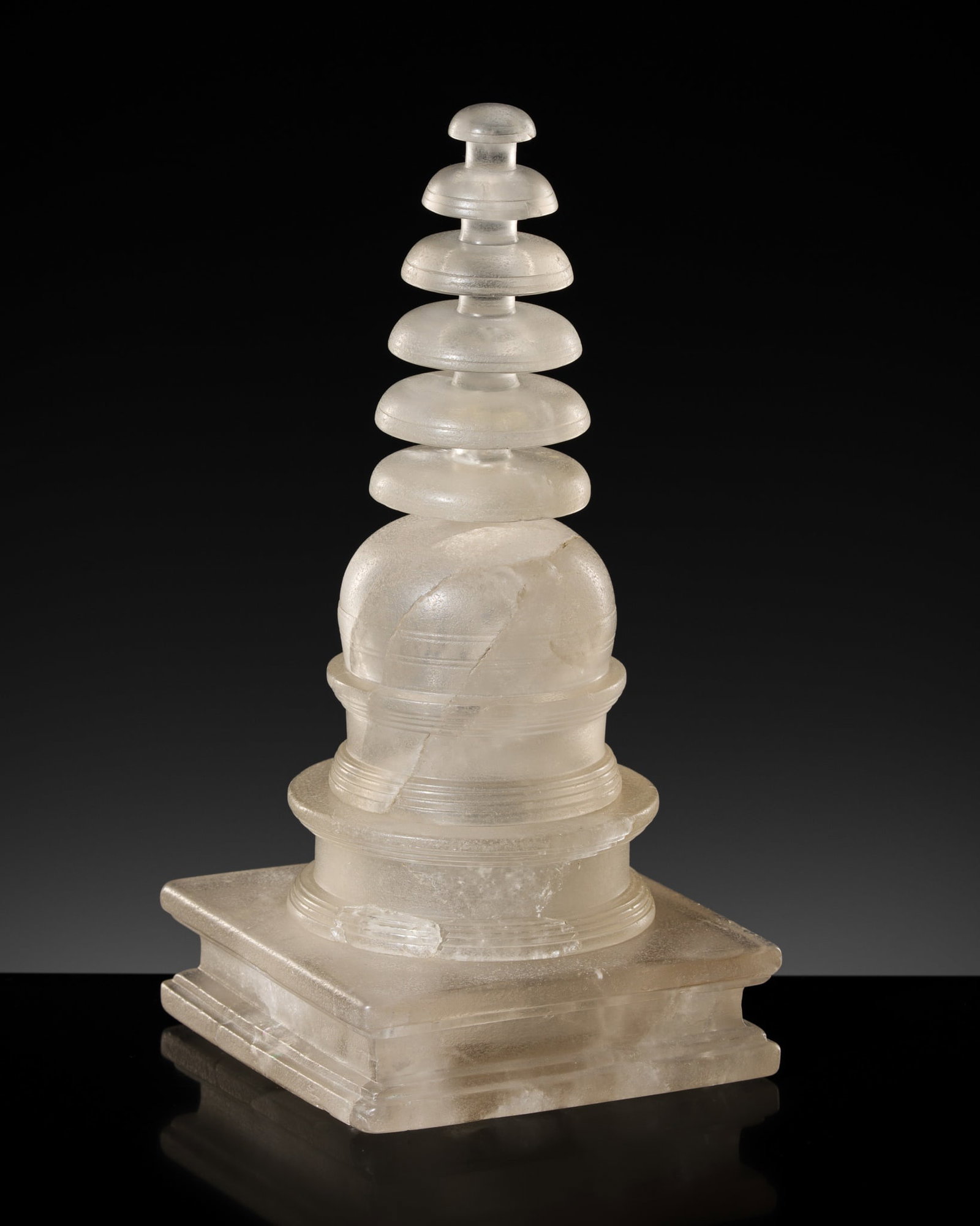A ROCK CRYSTAL RELIQUARY IN THE FORM OF A STUPA, ANCIENT REGION OF GANDHARA: A ROCK CRYSTAL RELIQUARY IN THE FORM OF A STUPA, ANCIENT REGION OF GANDHARA Kushan period, circa 1st-4th century. Finely worked, comprised of four fitted parts with a tiered spherical dome (anda)