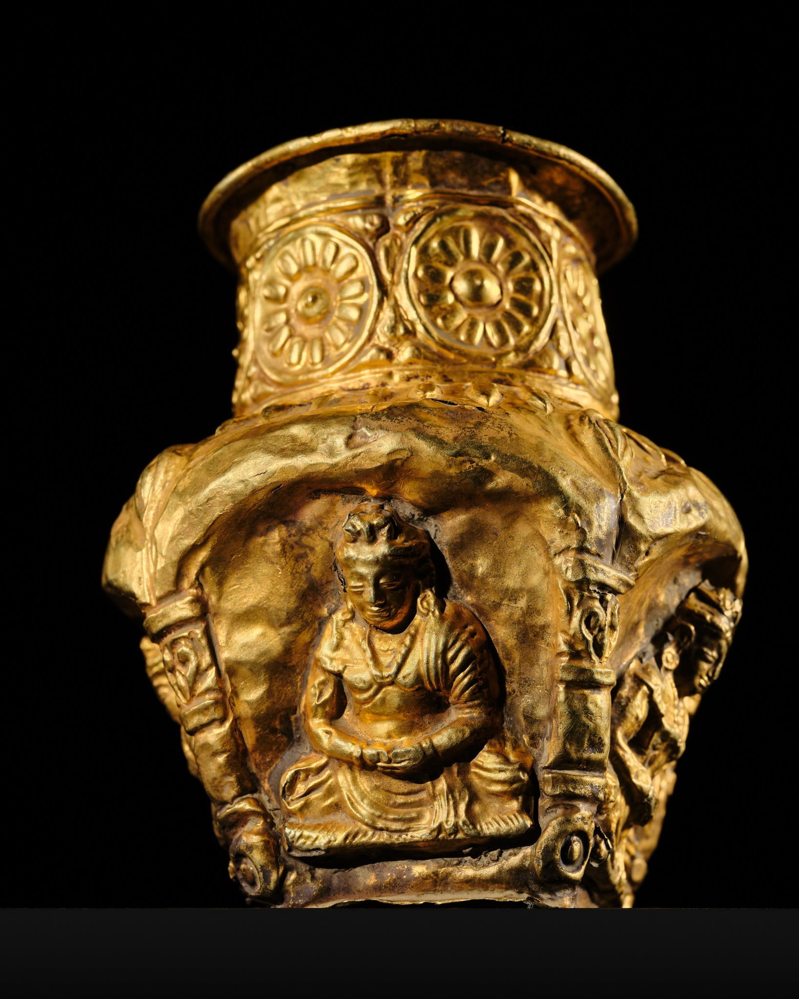 AN EXCEEDINGLY RARE GOLD REPOUSSÉ 'FOUR BODHISATTVAS' JAR, ANCIENT REGION OF GANDHARA: † AN EXCEEDINGLY RARE GOLD REPOUSSÉ 'FOUR BODHISATTVAS' JAR, ANCIENT REGION OF GANDHARA Kushan Empire, 1st-5th century AD. Magnificently worked, the faceted body gently tapering toward a