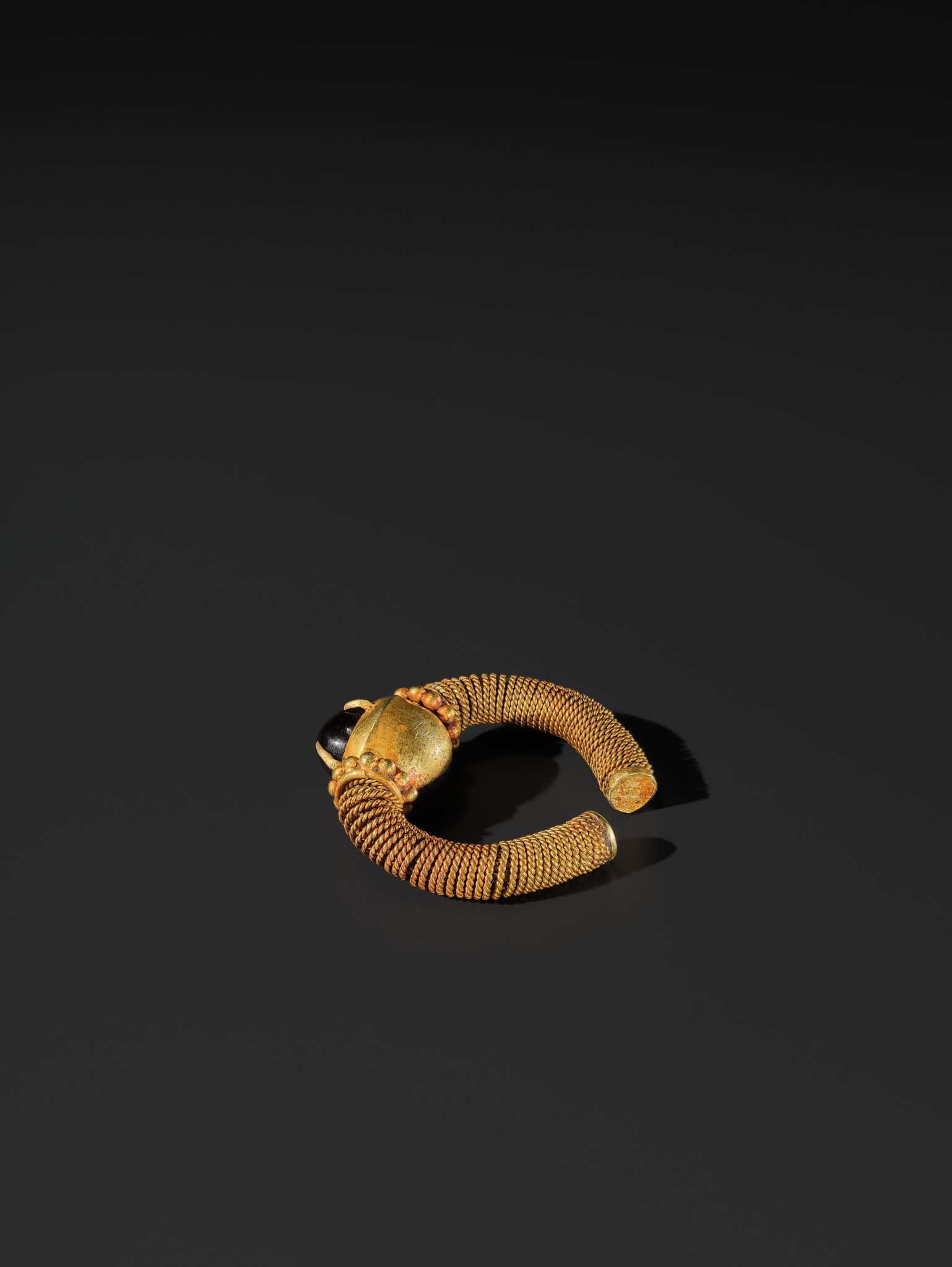 A RUBY-INSET GOLD RING, EAST JAVA, CIRCA 6TH-10TH CENTURY - 8